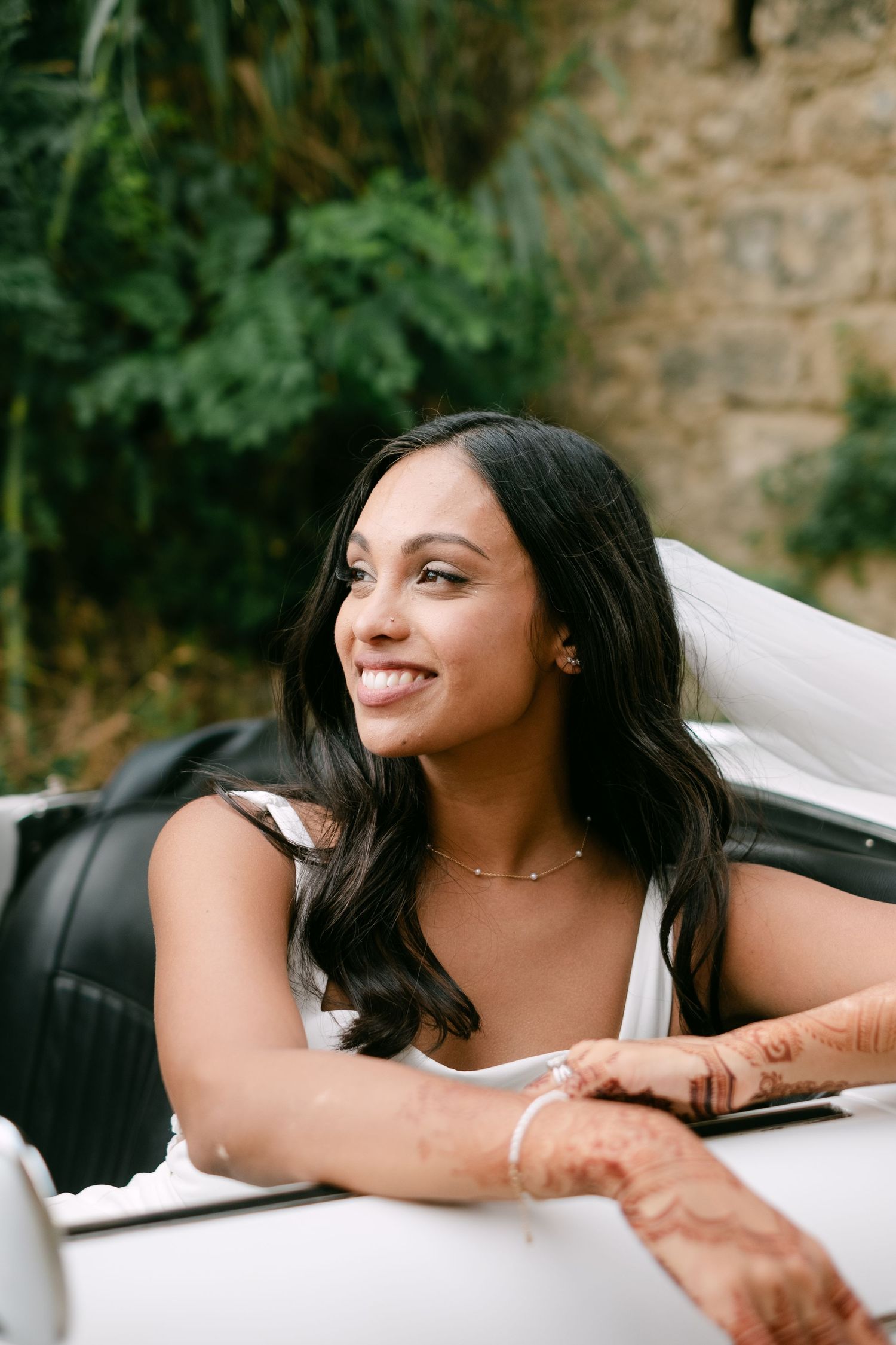 A sequence of candid wedding portraits showing a bride reclining in an outdoor setting with natural greenery.