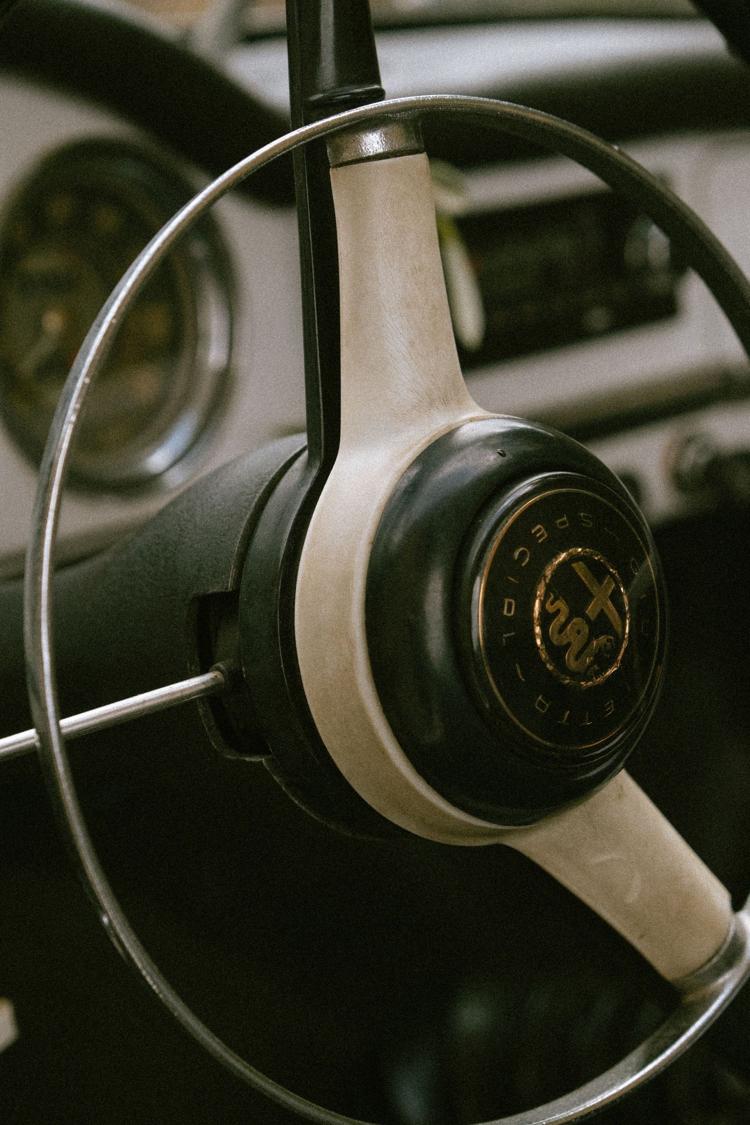Close-up shots of vintage car steering wheels showing classic automotive design details.