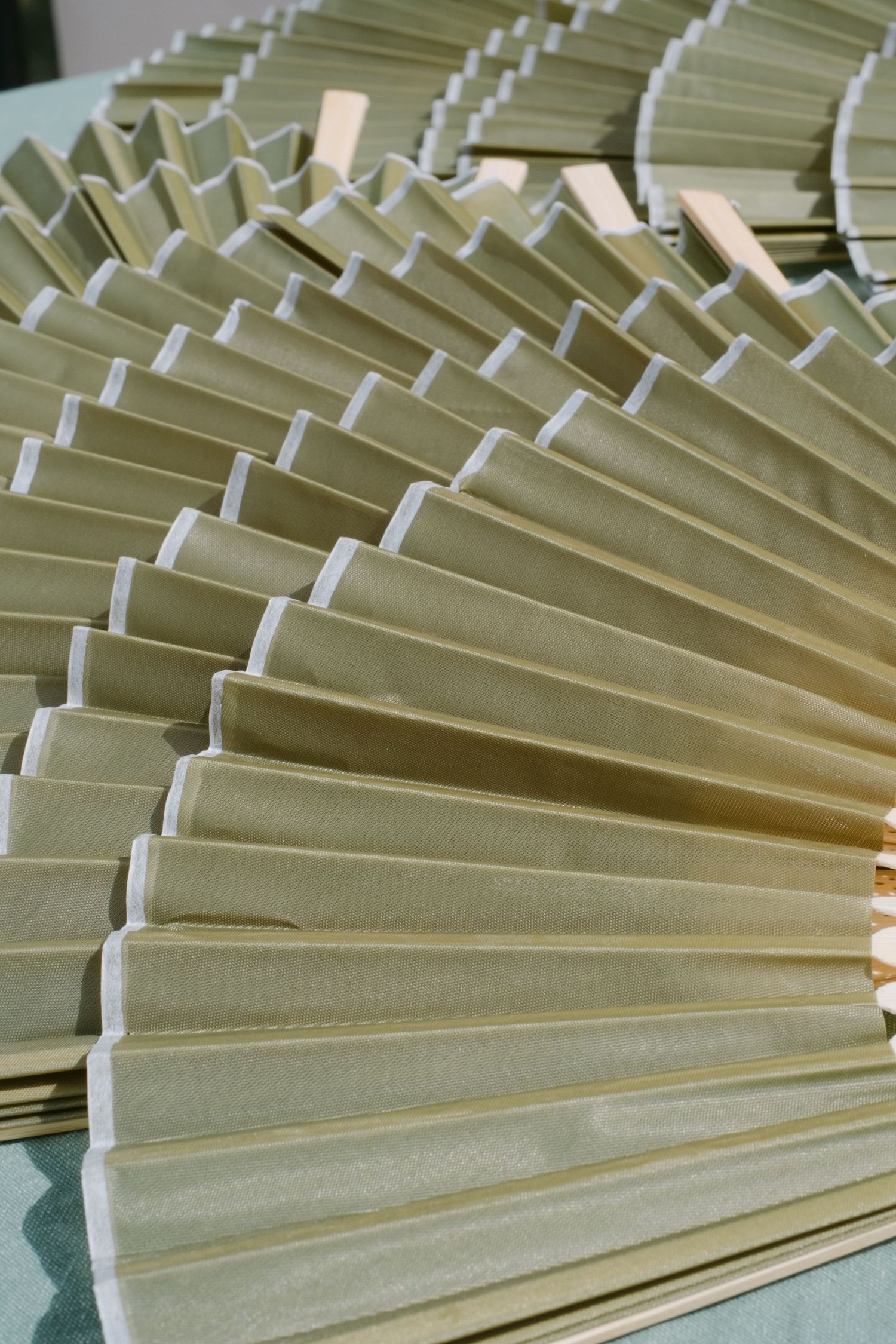 Close-up of pleated paper fan decorations arranged in geometric pattern.