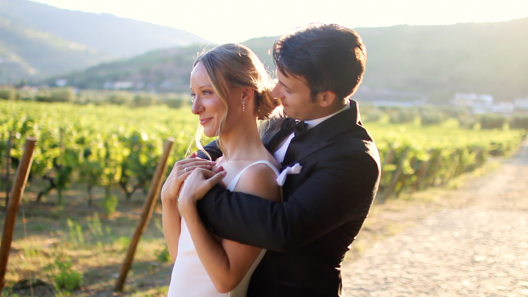Romantic moment captured in a vineyard during golden hour.