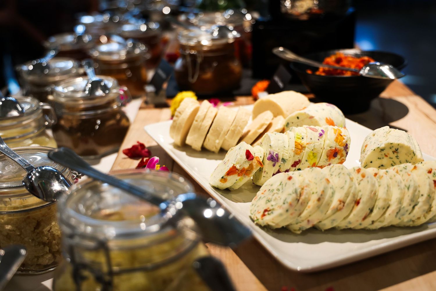 Assorted appetizers and hors d'oeuvres beautifully displayed on a catering table at an event.