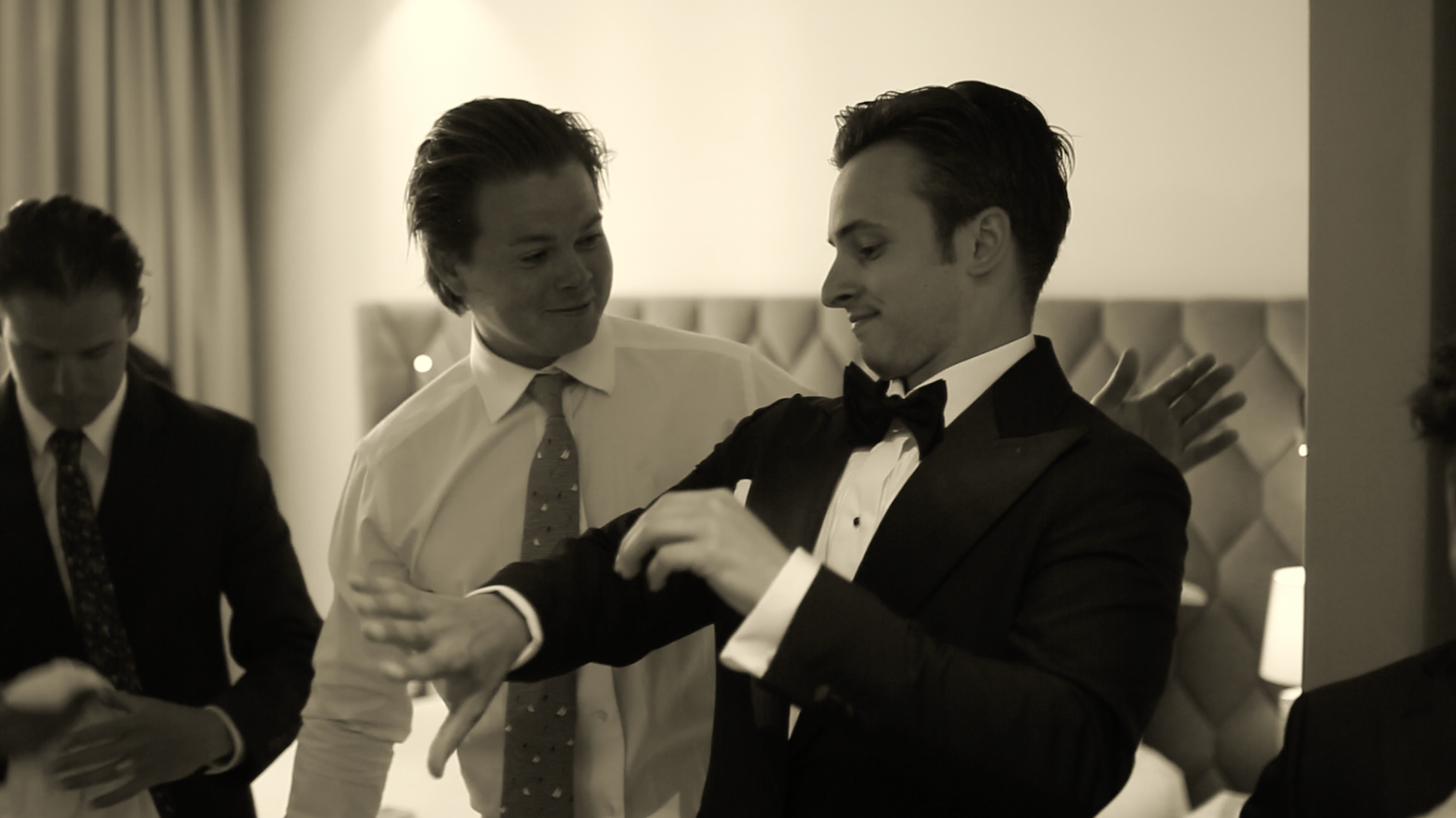 Indoor reception venue with elegant mood lighting and formal attire.