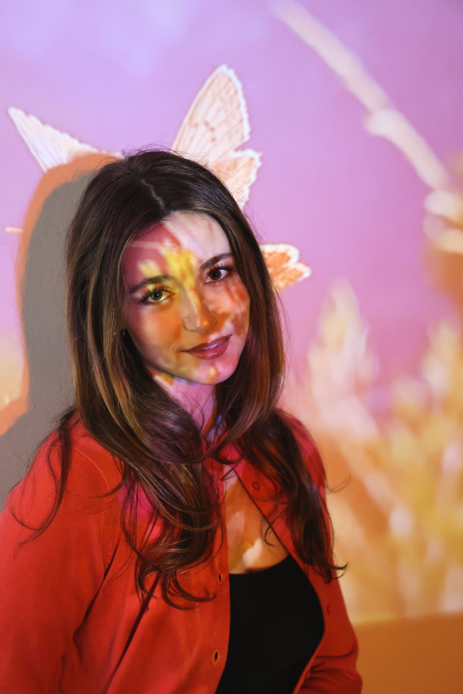 Artistic portrait series with colorful lighting effects and butterfly wings overlay.