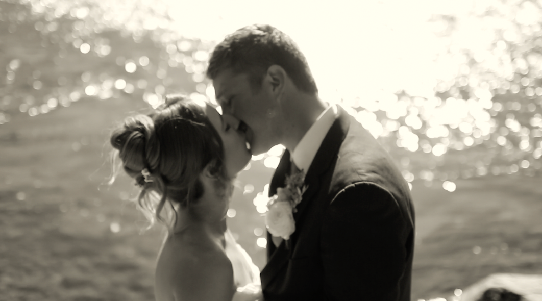 Black and white beach wedding photos with sunlight sparkling on water.