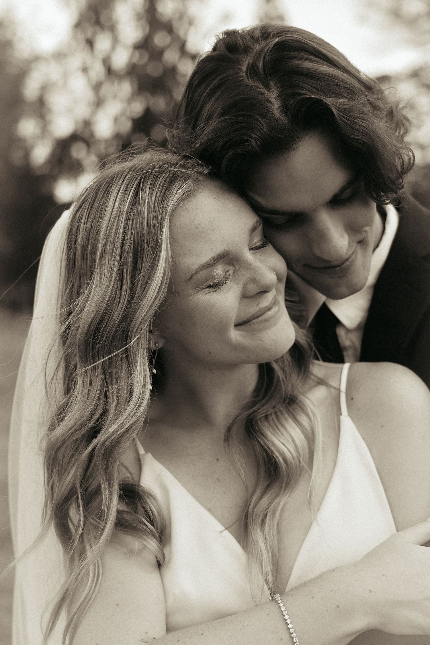 A series of intimate black and white wedding portraits showing tender moments.