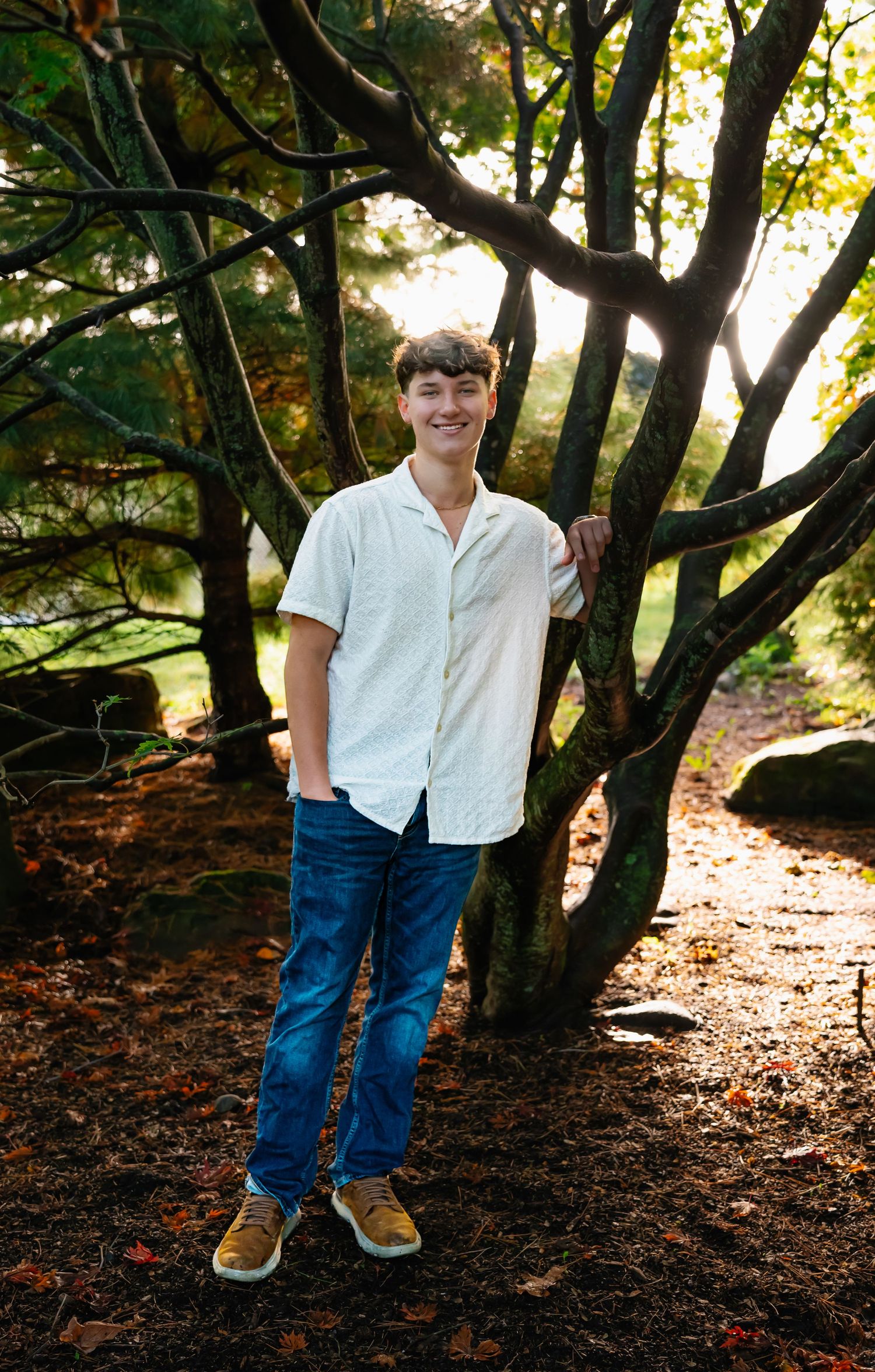 A sequence of photos showing someone in a white shirt and jeans standing among trees in dappled sunlight.