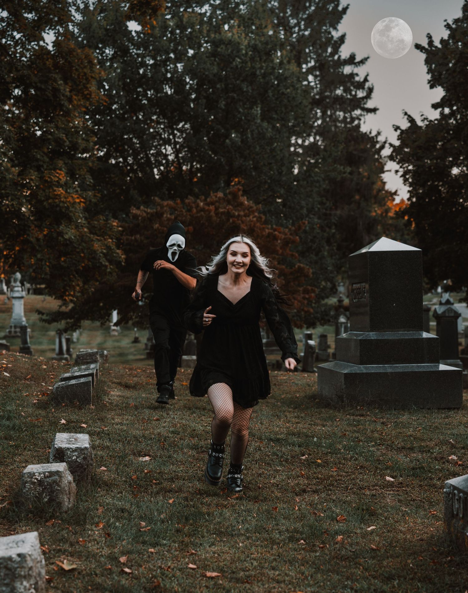 A series of moody photos showing someone in dark clothing dancing and posing dramatically in a foggy cemetery at dusk.