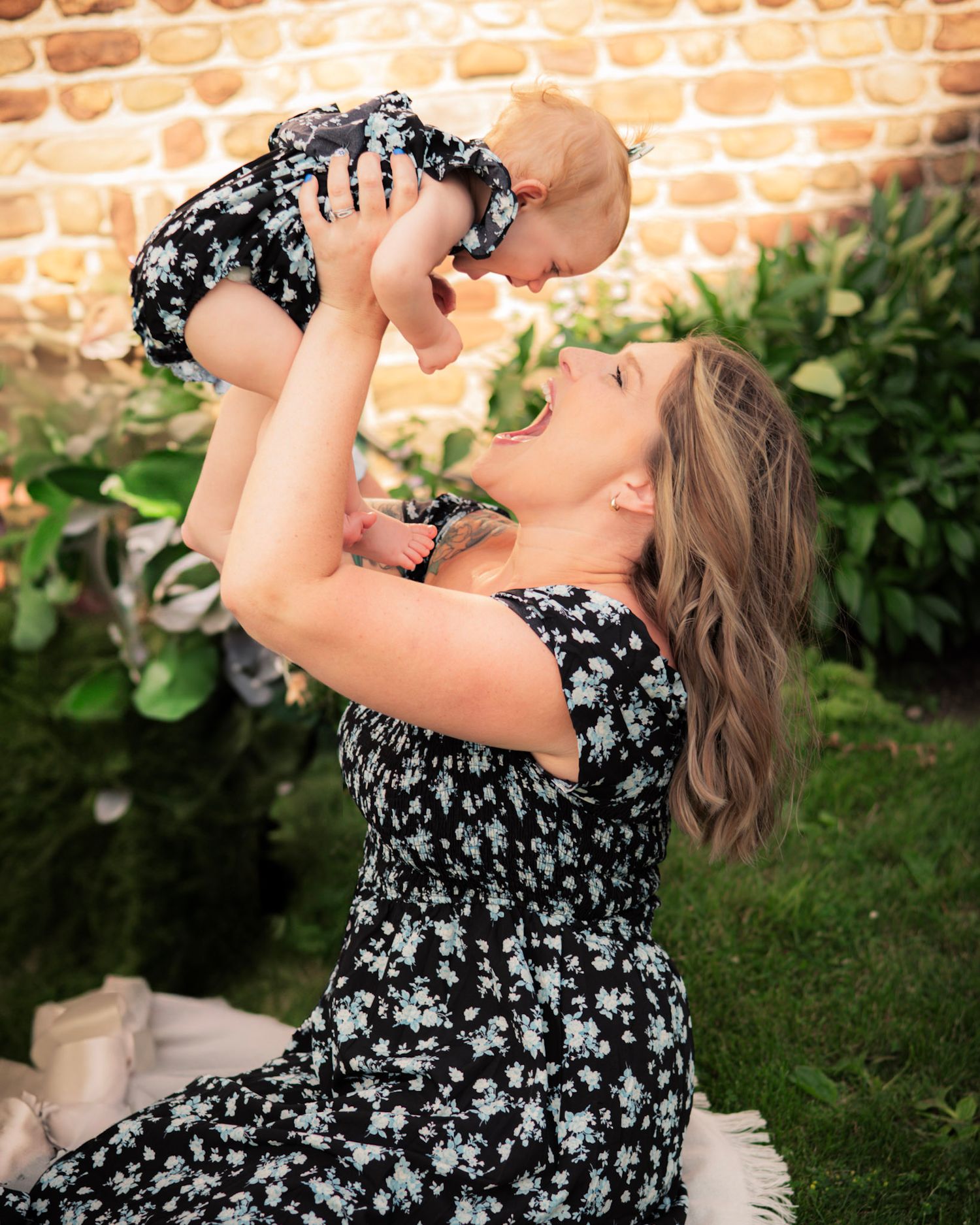 Close-up sequence of someone in a floral dress drinking from a wine glass against a brick wall backdrop.