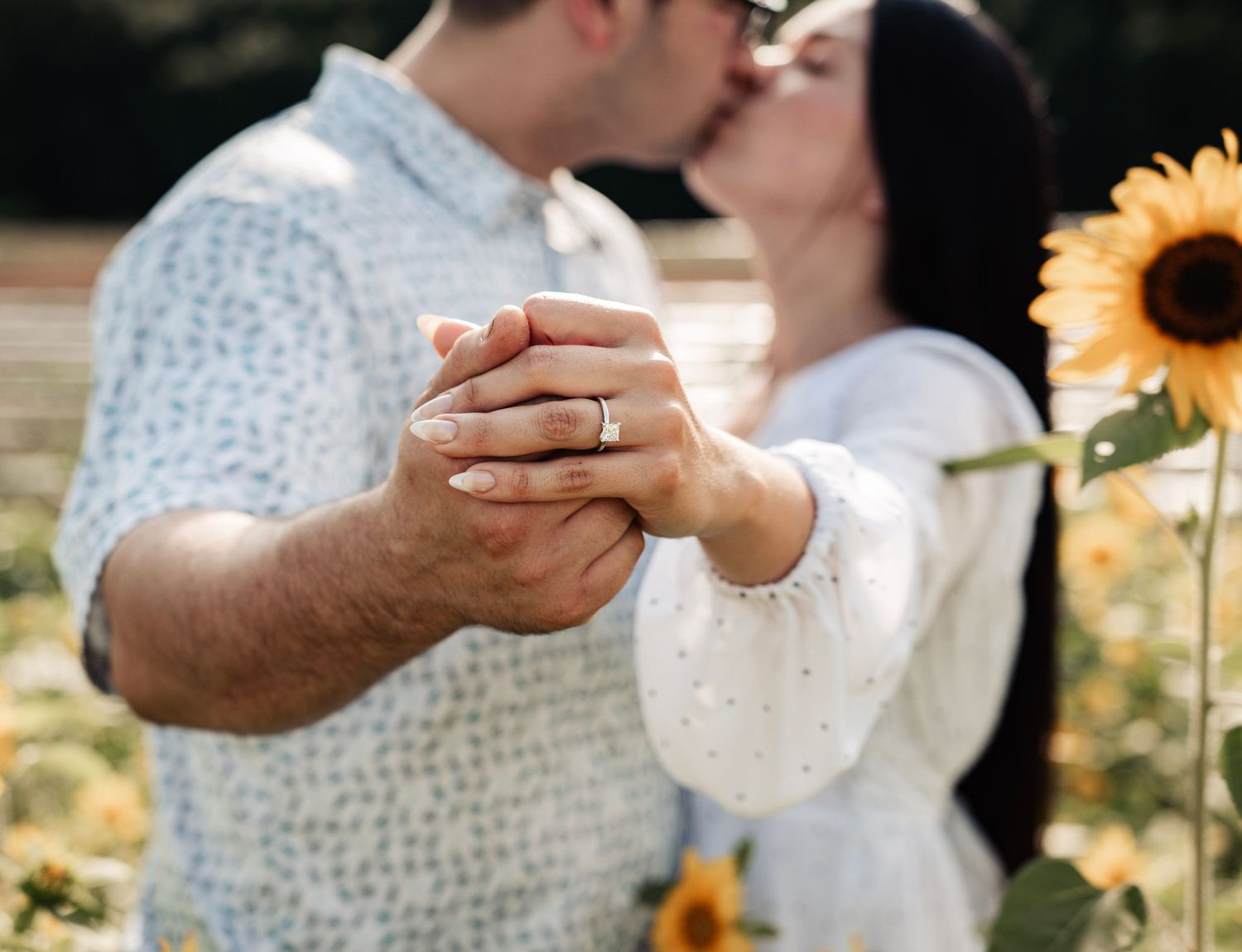 Couple embracing outdoors with warm golden hour light