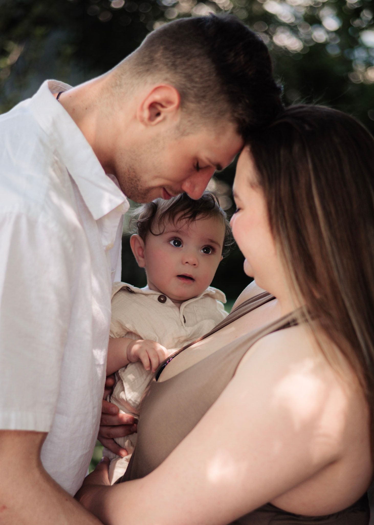Sweet family moment outdoors showing closeness and connection.
