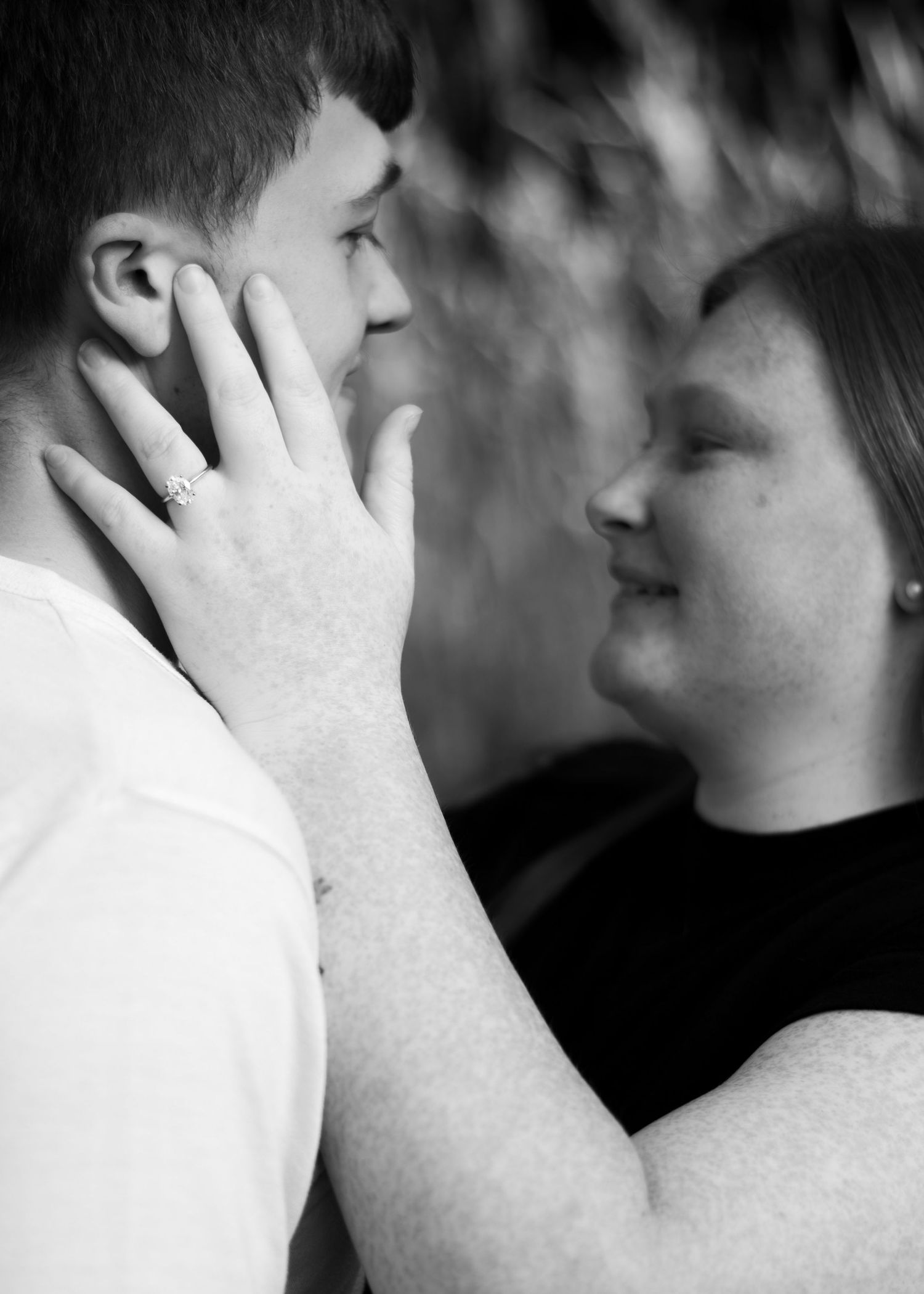 Intimate black and white close-up shots showing emotional expressions.