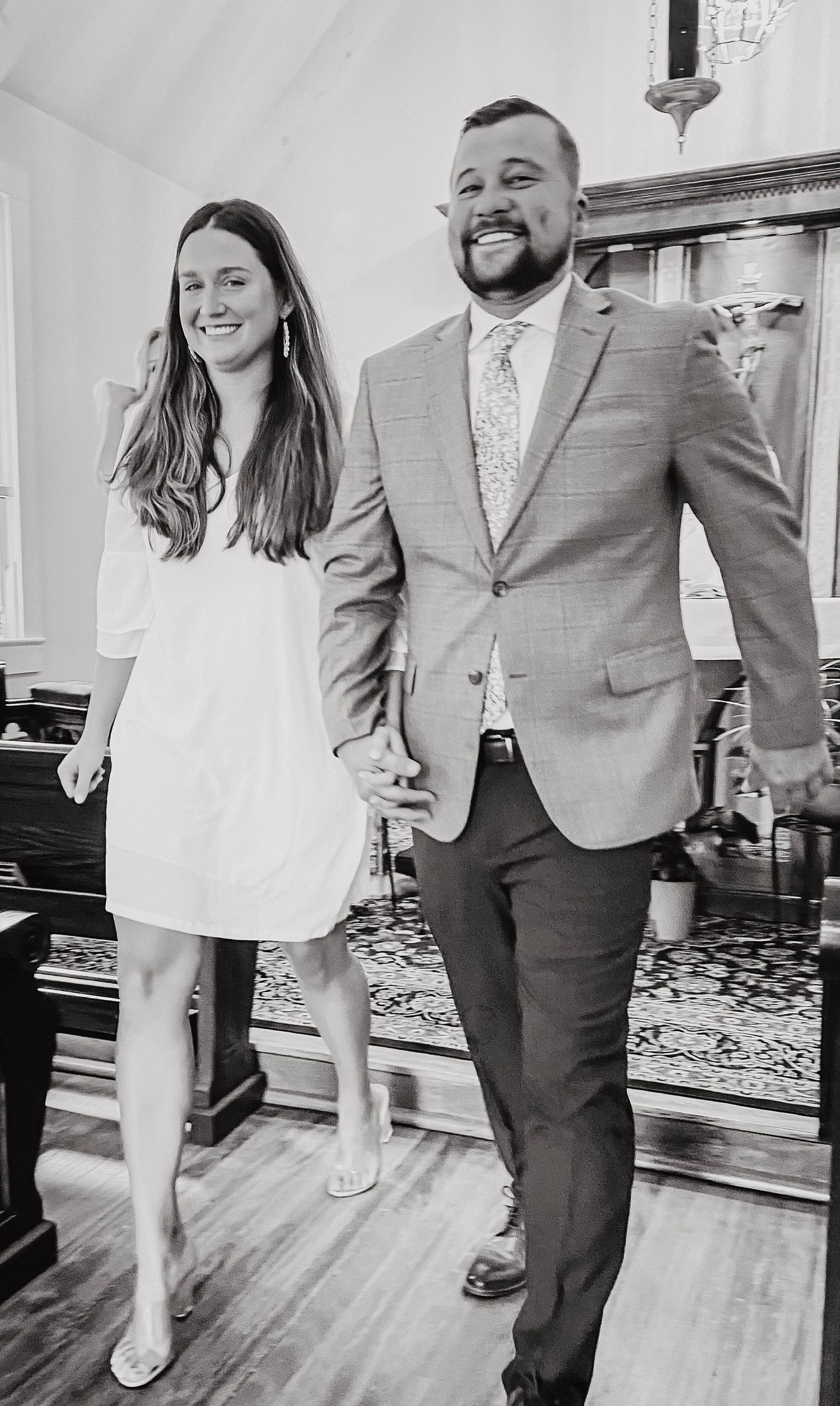 Black and white photos showing fun interactions in an indoor setting with hardwood floors.