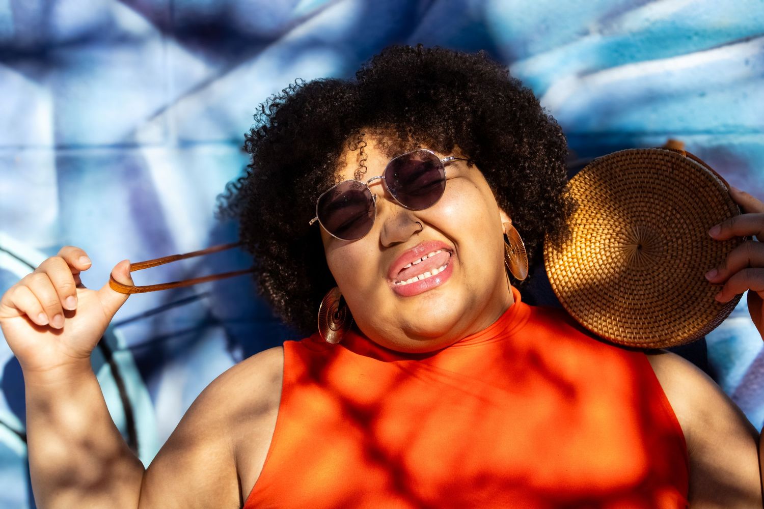 A series of selfie-style photos showing people in orange shirts and sunglasses enjoying a sunny day outdoors.