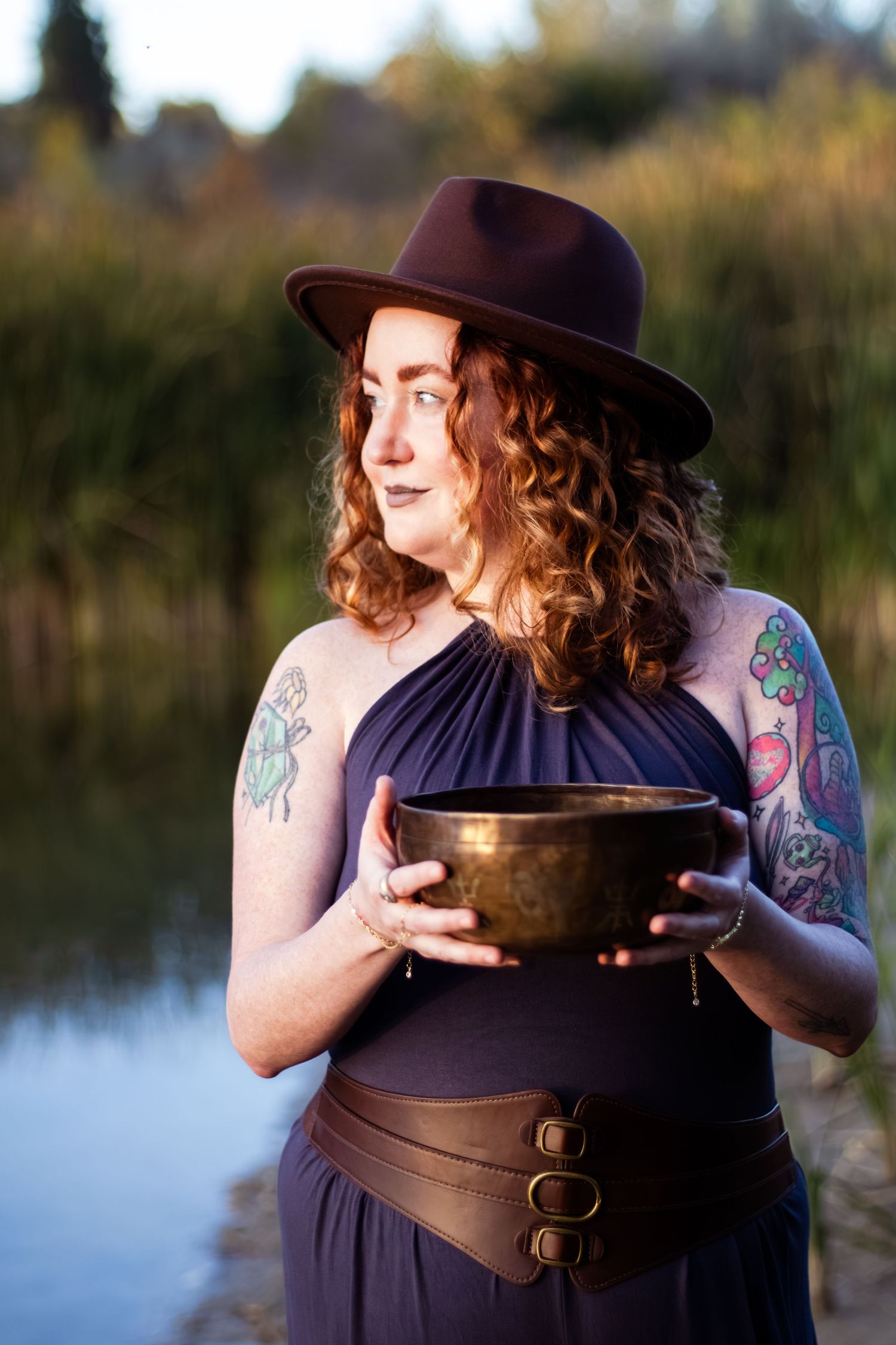 A person in dark clothing poses with a bowl by a lake in a sequence of outdoor photos.