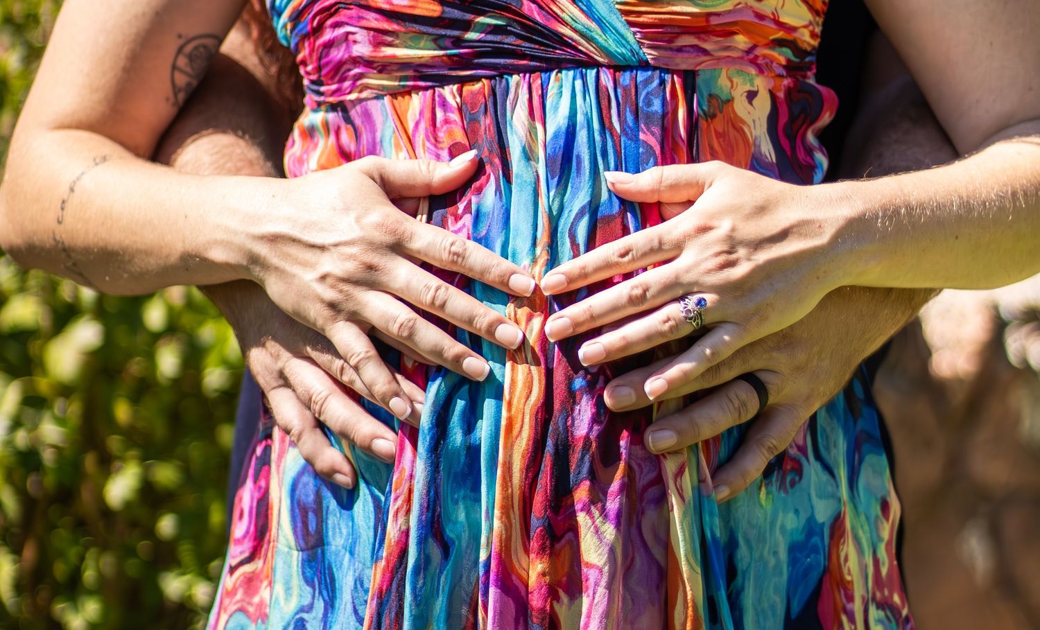 A colorful tie-dye dress is shown in a series of close-up detail shots highlighting the vibrant fabric pattern.