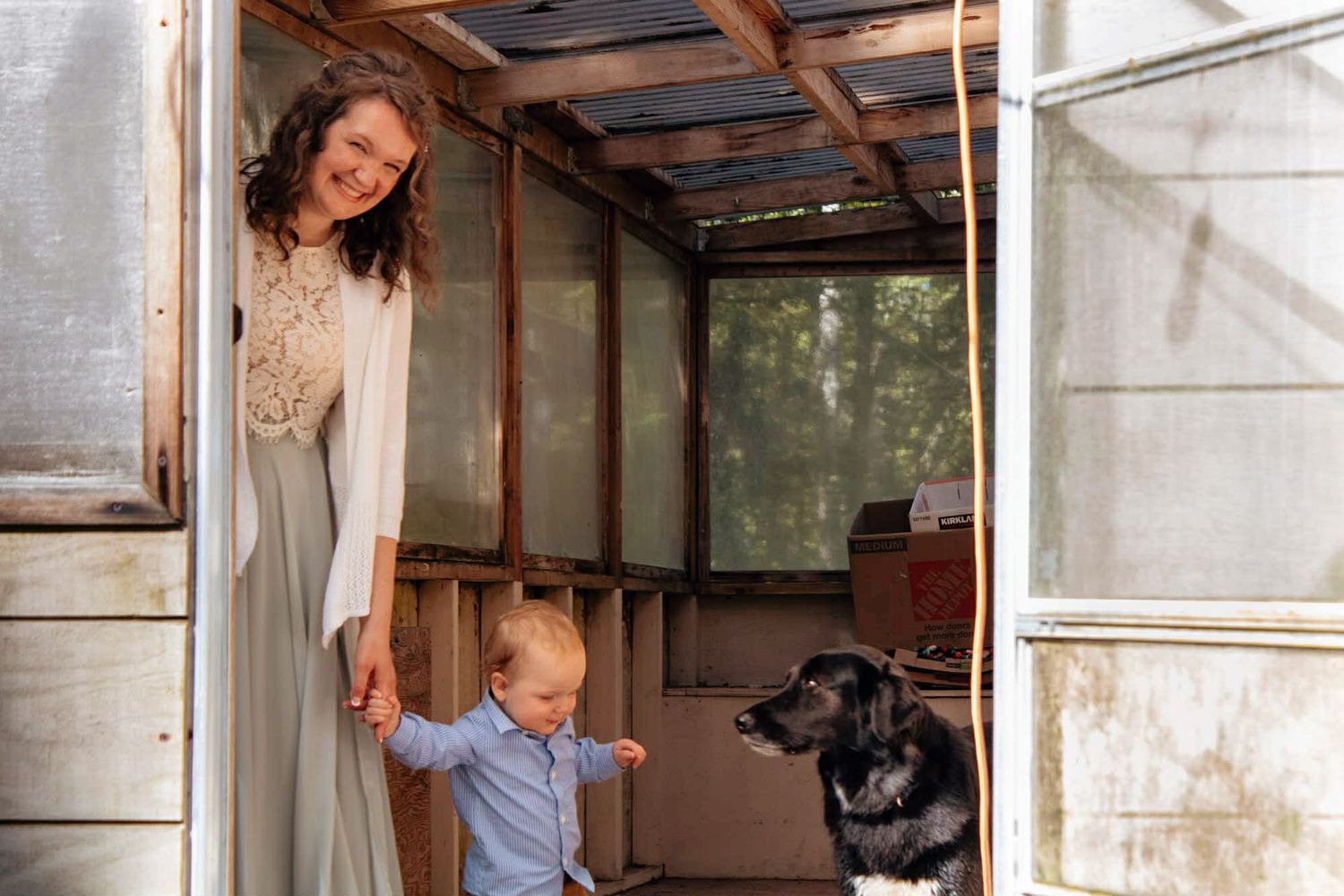 A series of photos showing a family working together to renovate the interior of a rustic cabin.