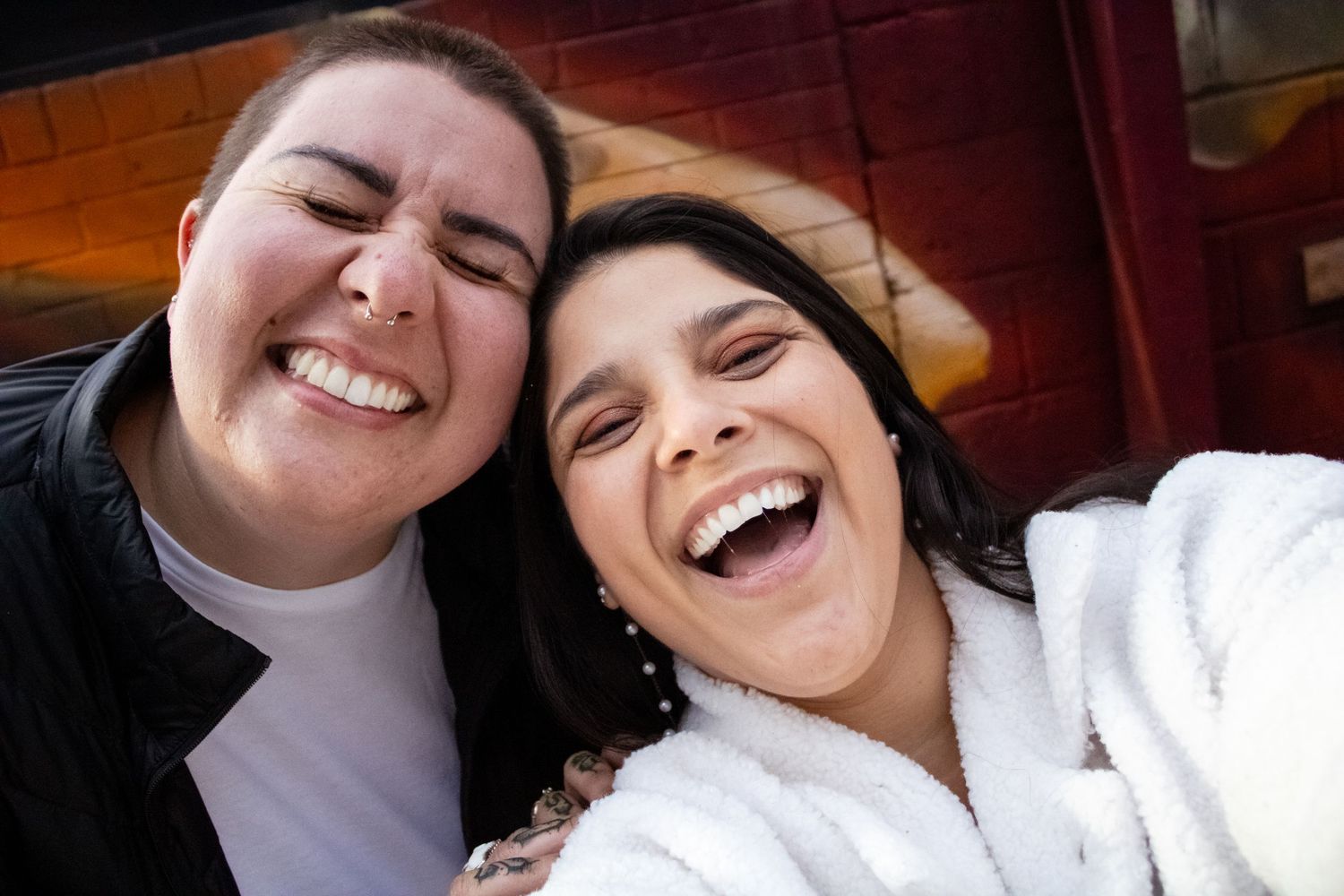 A series of candid photos showing joyful laughter and genuine happiness between two people in close-up shots.