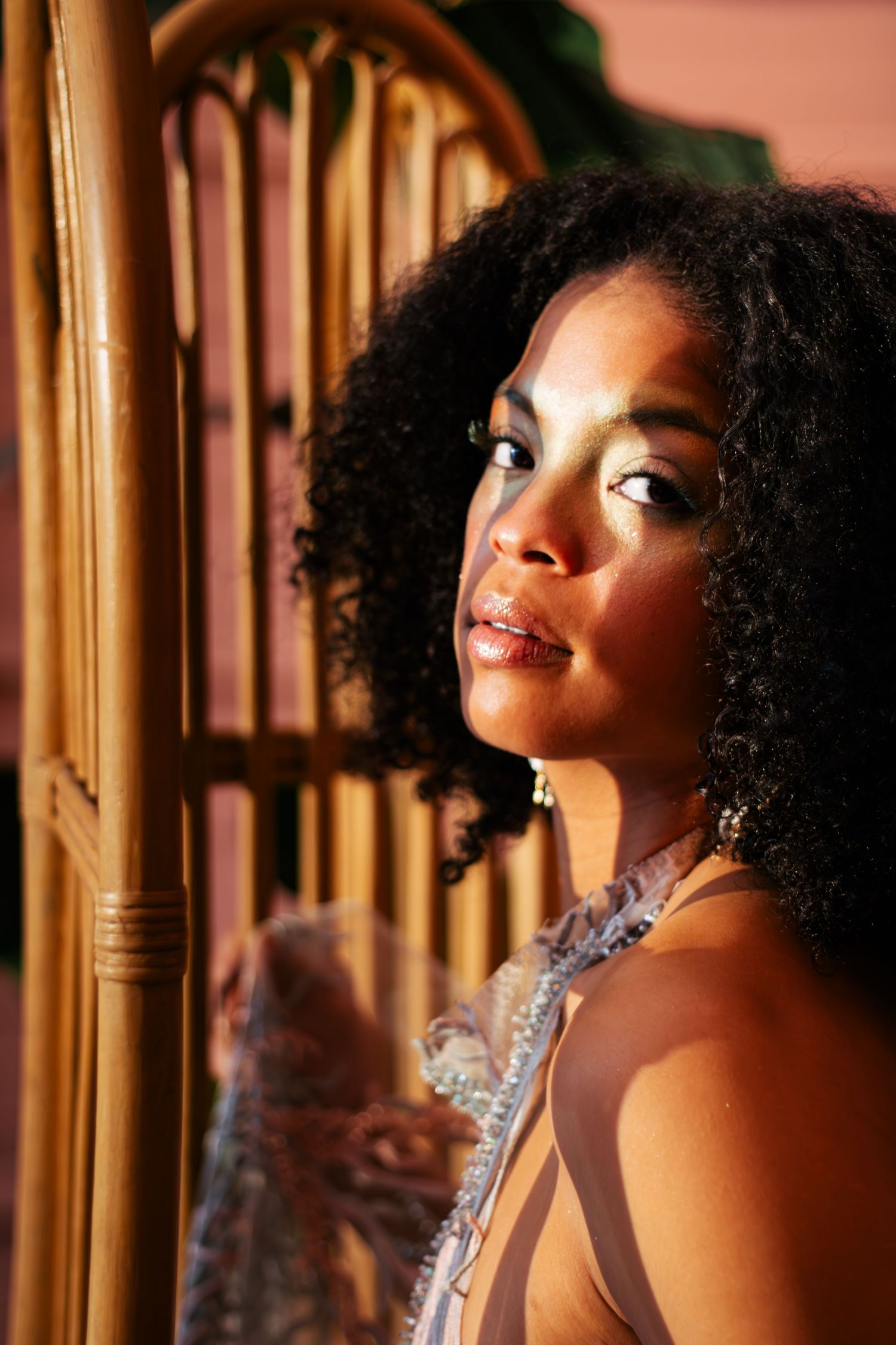Artistic portrait series with warm lighting and dramatic shadows against a golden backdrop.