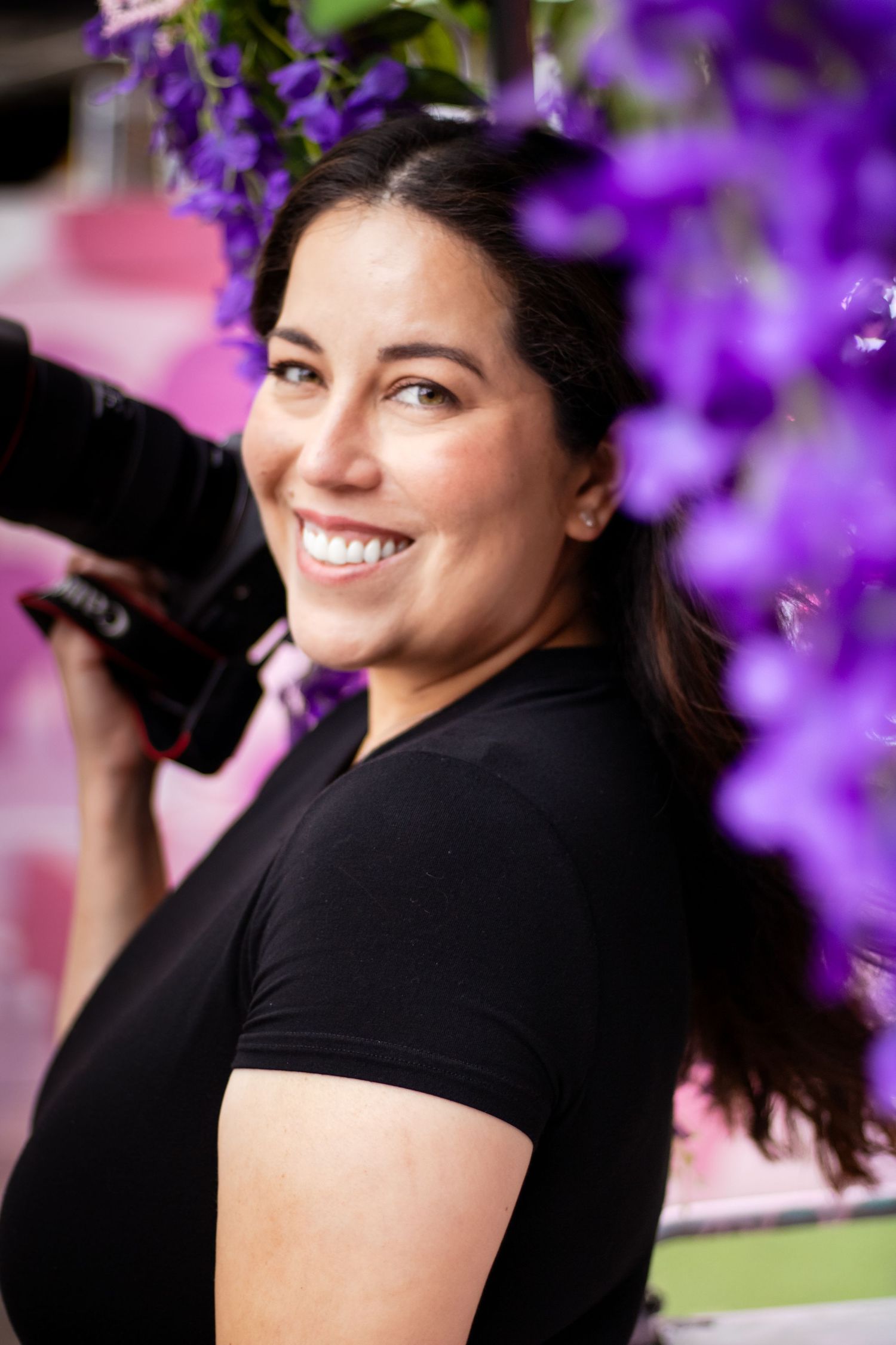 A portrait series shows someone in a black shirt against purple flowers in soft focus background.