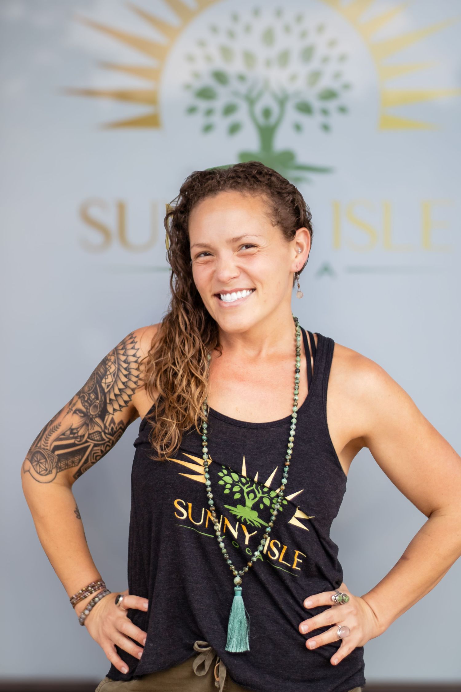 A series of four photos showing someone in a black tank top with Sunnyside branding against a light background.