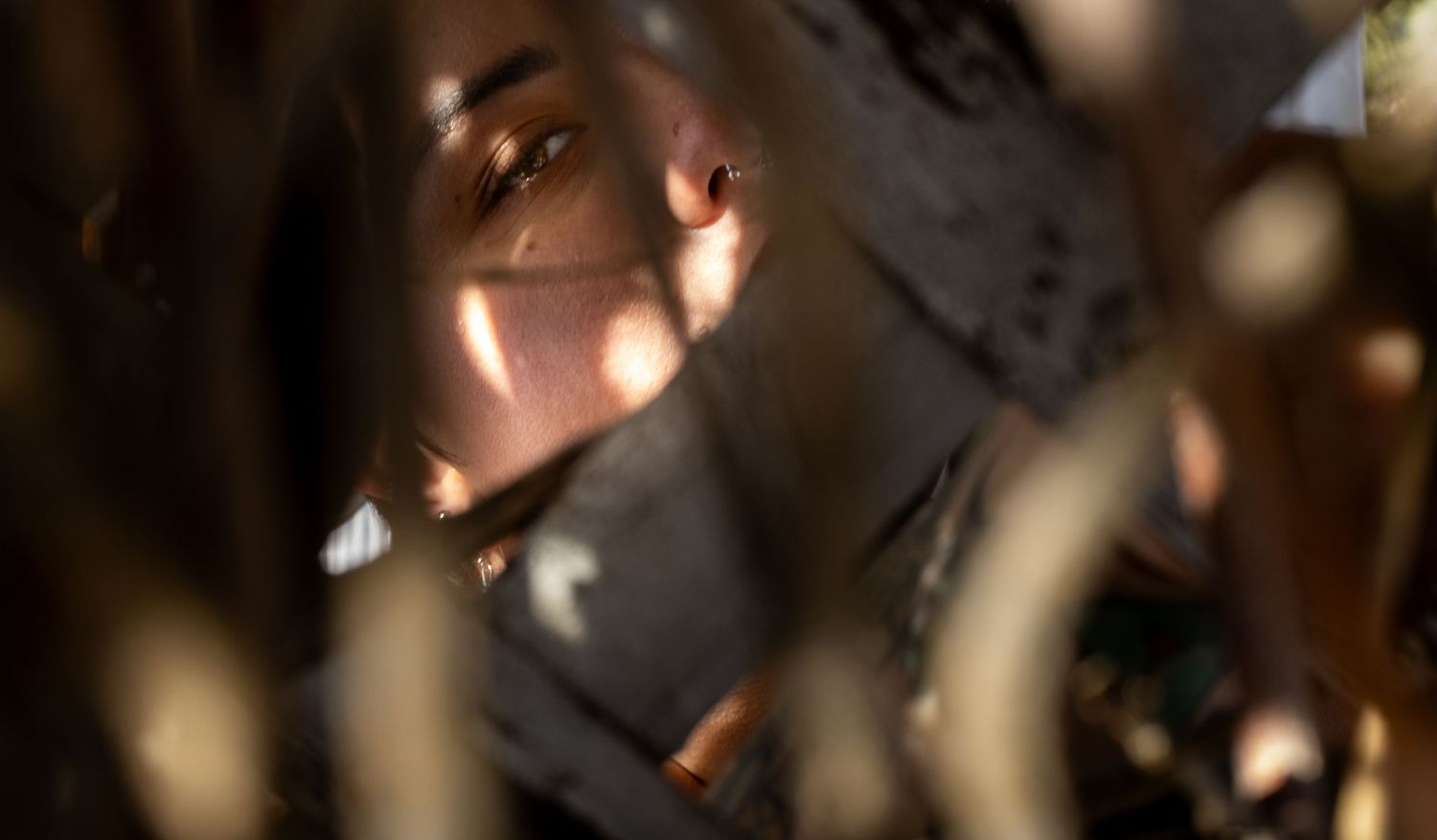 A blurred bokeh background with warm glowing lights creates a dreamy, abstract atmosphere.