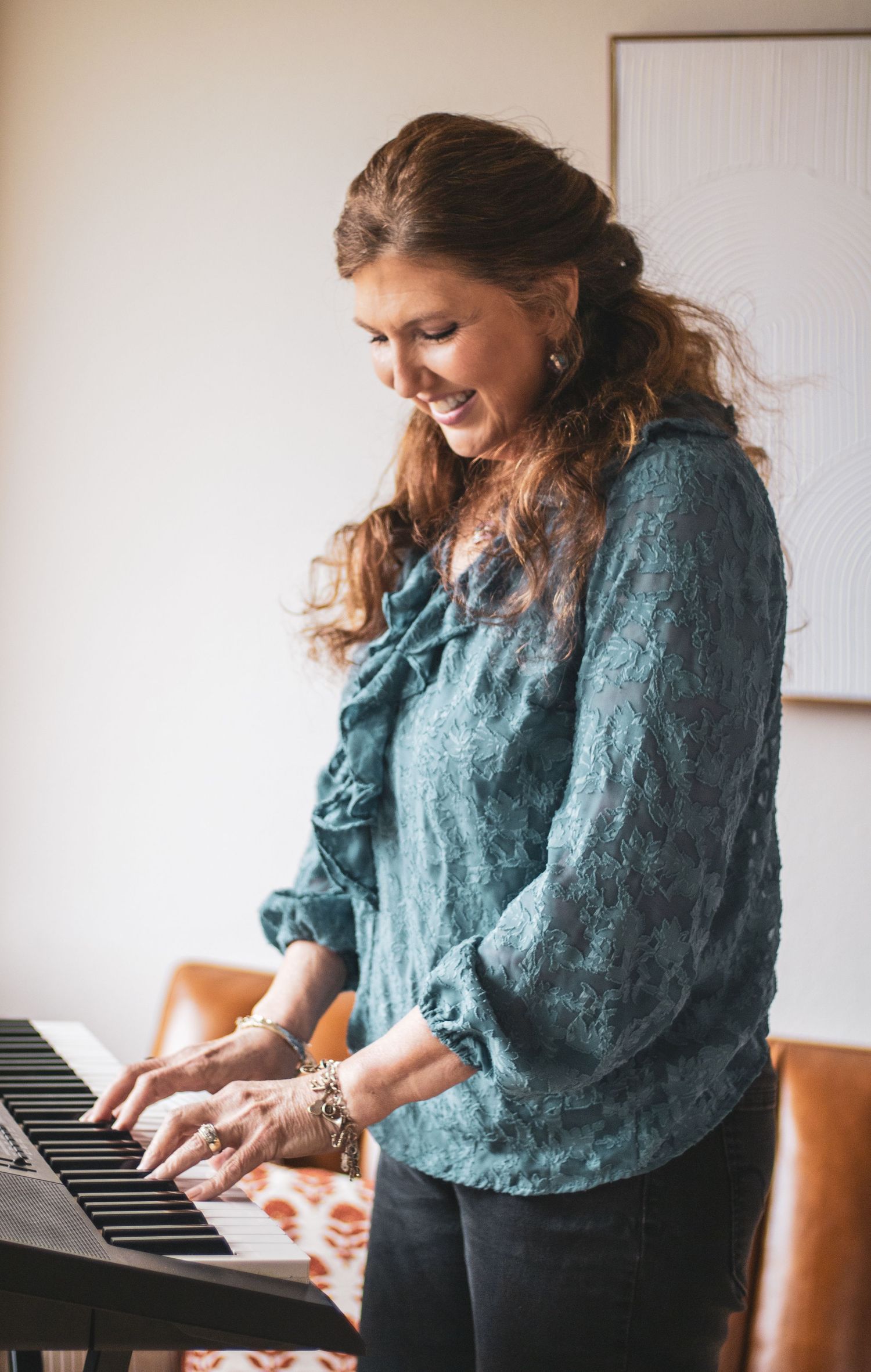 A musician in a teal blouse plays piano expressively in a bright indoor setting, shown in a series of action shots.
