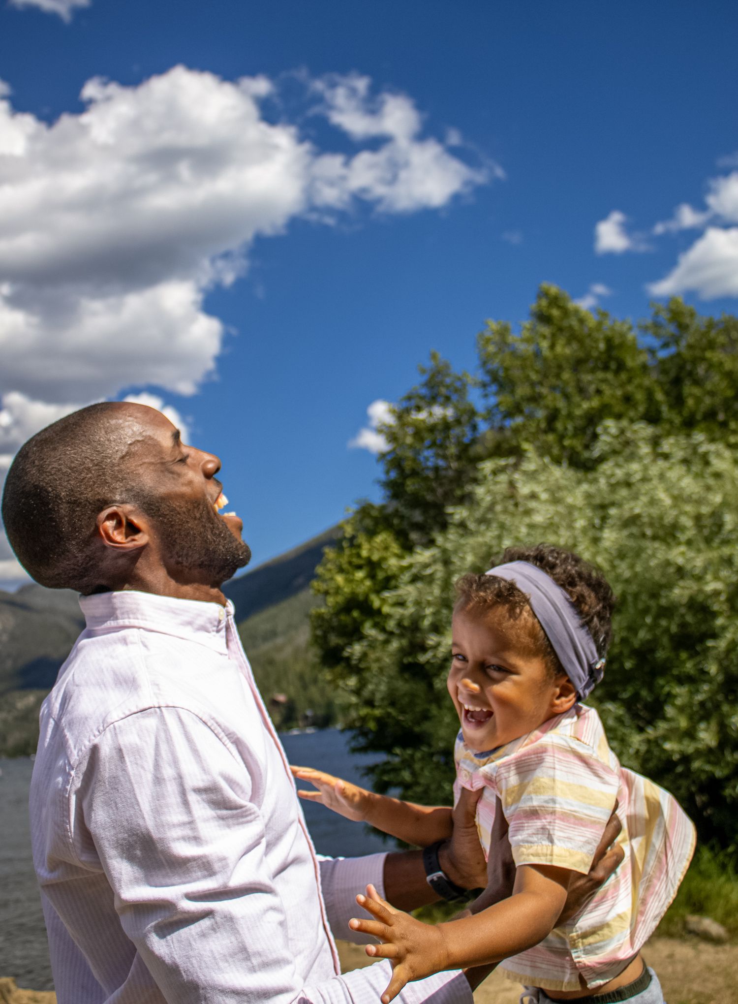 A sequence of joyful moments captured outdoors showing interaction between two people against a blue sky and trees.