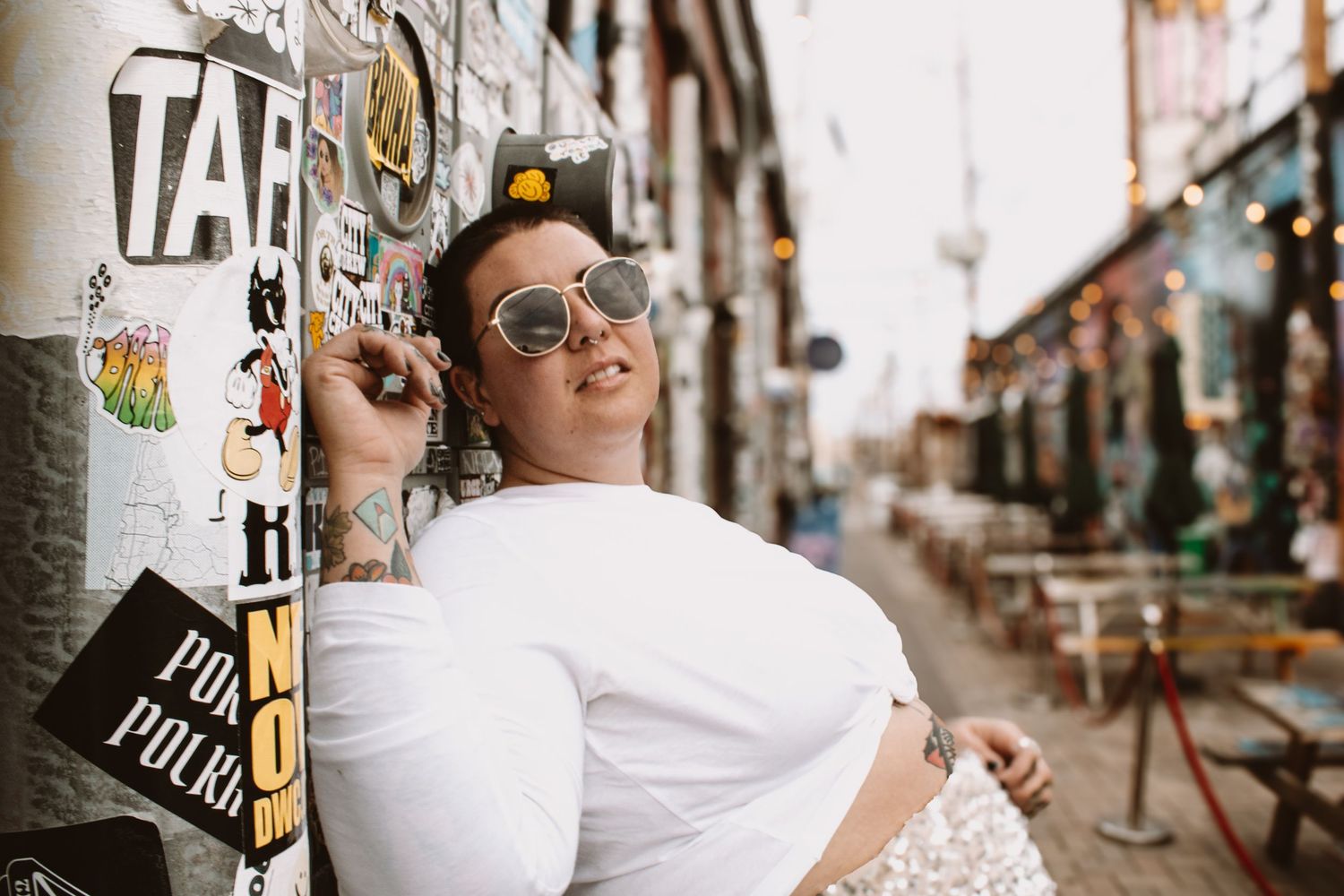 A series of lifestyle photos showing urban scenes with coffee cups, sunglasses, and casual fashion accessories.