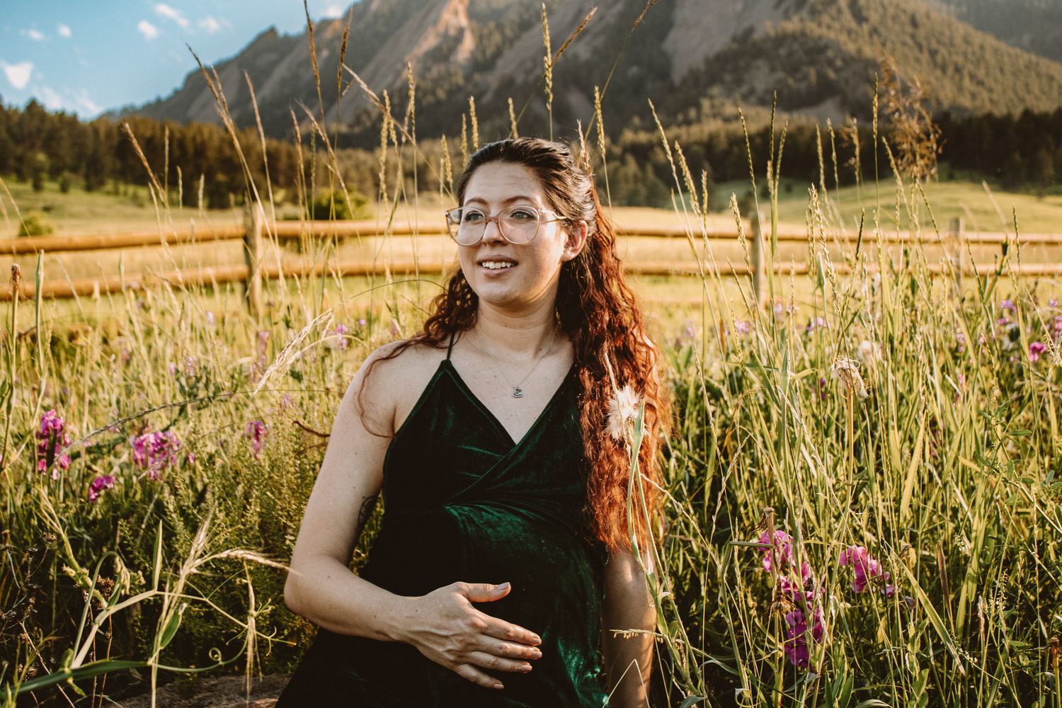 A group of candid lifestyle photos taken at sunset in a golden field with mountains in the background.