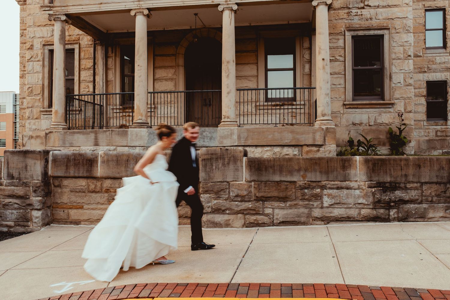 Historic stone building exterior with classic architectural columns and steps.