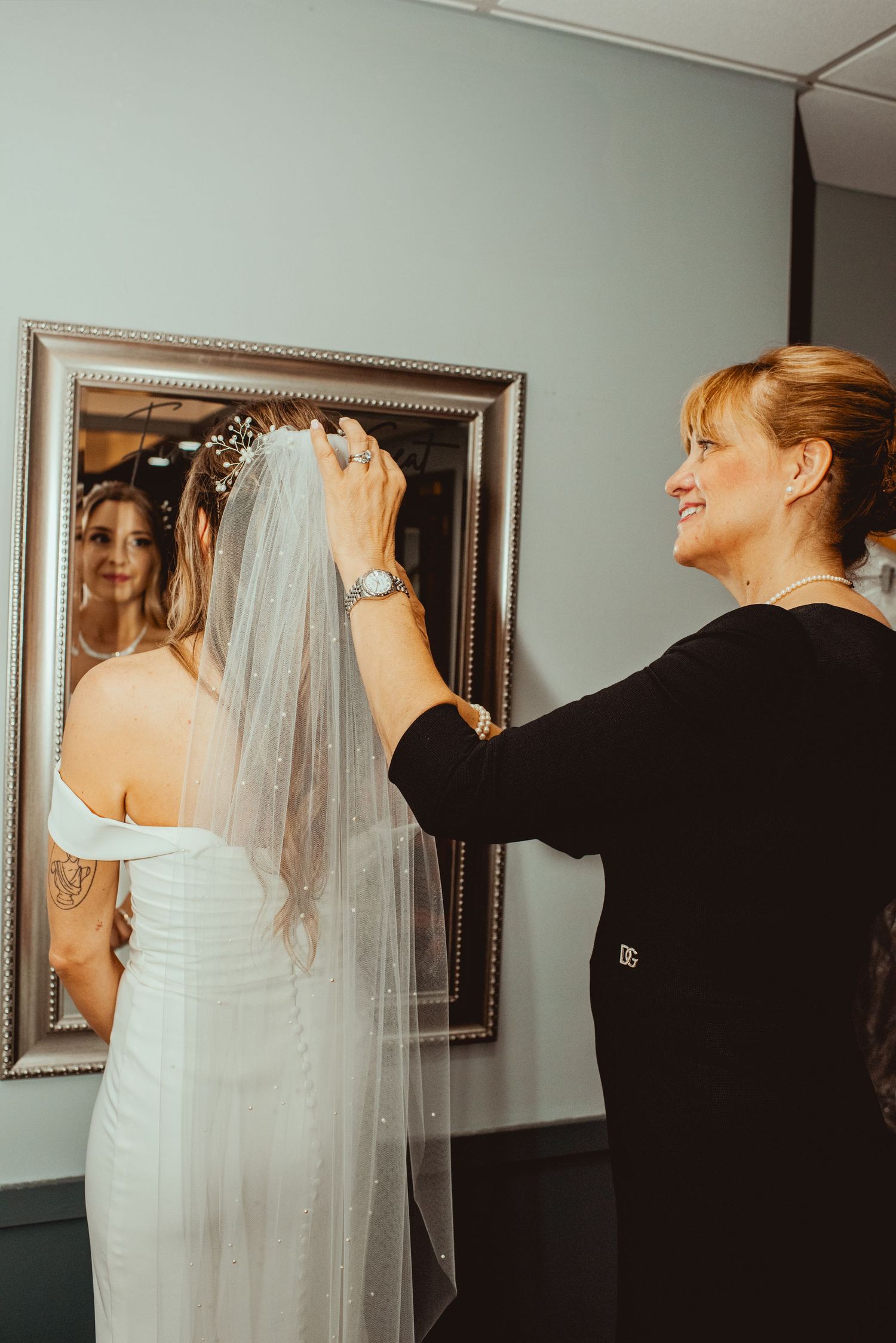 A series of wedding preparation shots showing the final touches being made with a flowing white veil.