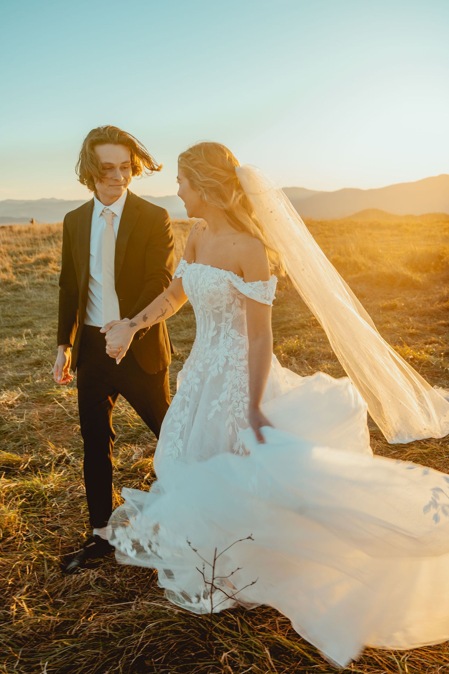 A romantic wedding photo series captured at golden hour showing a couple in formal attire against a desert landscape.