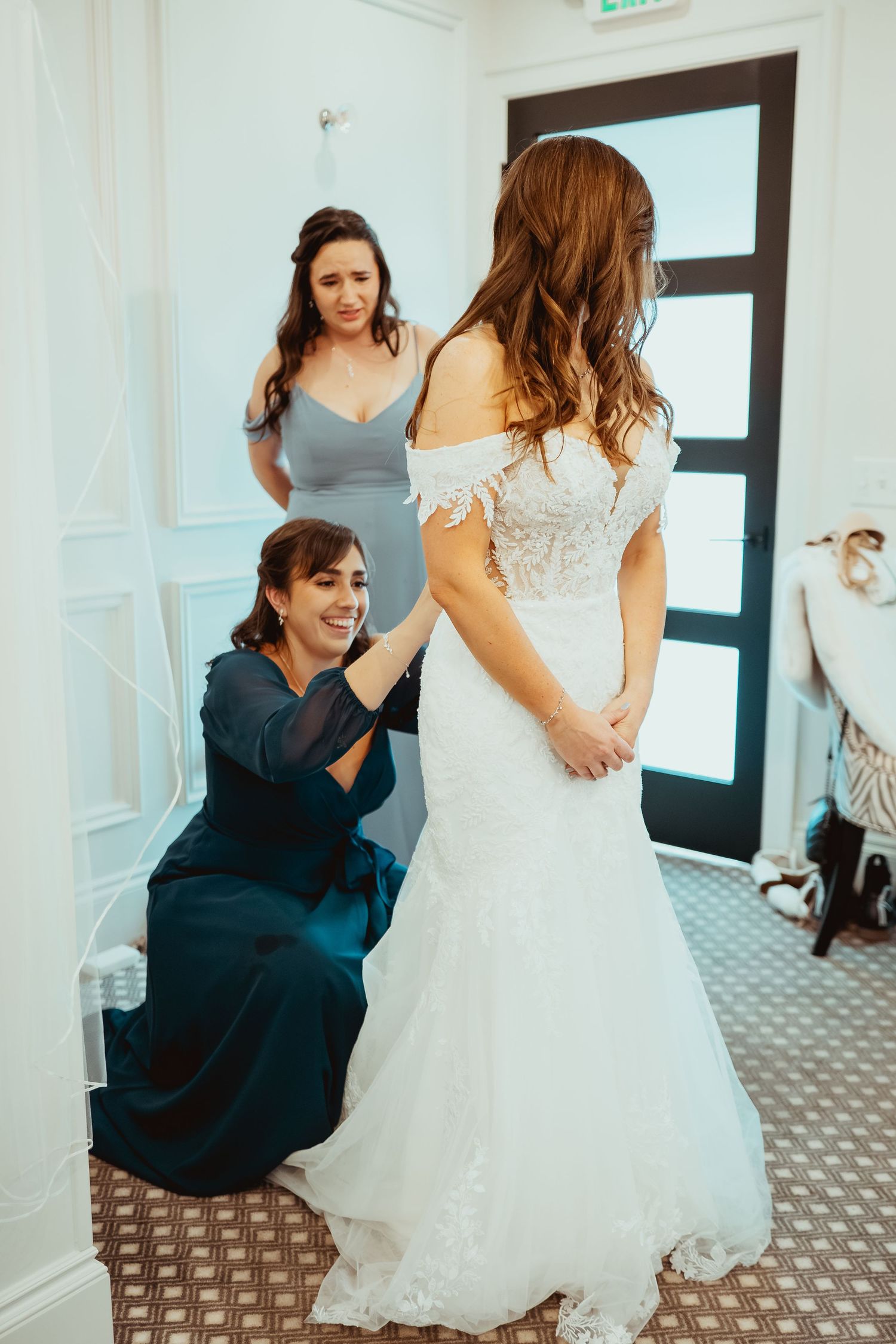 A wedding party moment captured in a series of four sequential photos showing reactions and emotions in a hotel hallway.