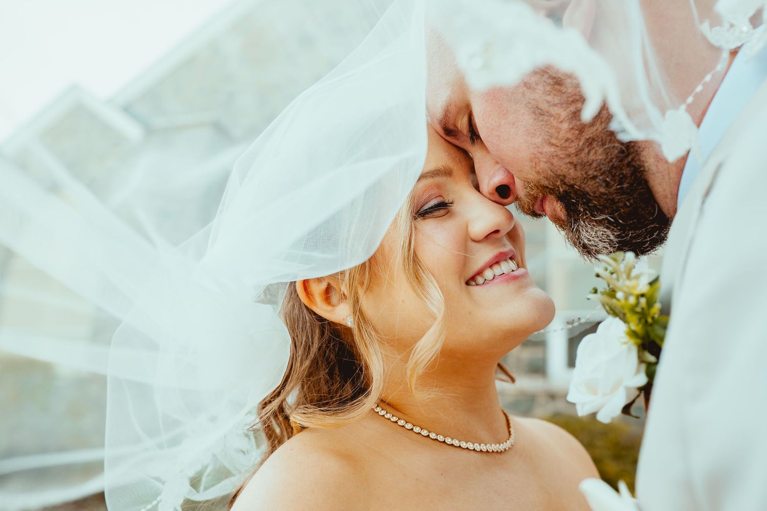 Romantic wedding couple shares intimate kisses in multiple candid photos with bright natural lighting.