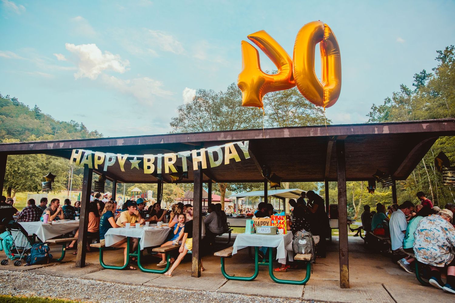 A collection of outdoor party scenes with balloons, banners, and decorations at what appears to be a birthday celebration.