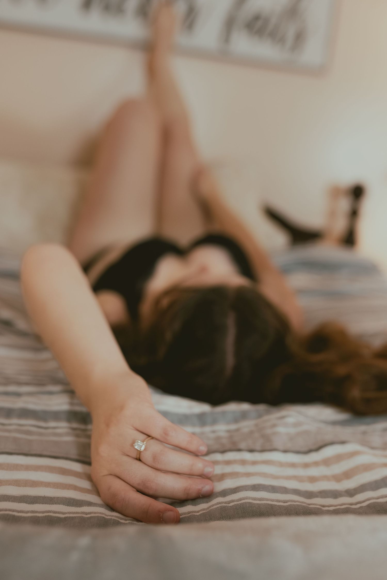 Close-up photo series of a hand with engagement ring resting on striped bedding in soft natural light.