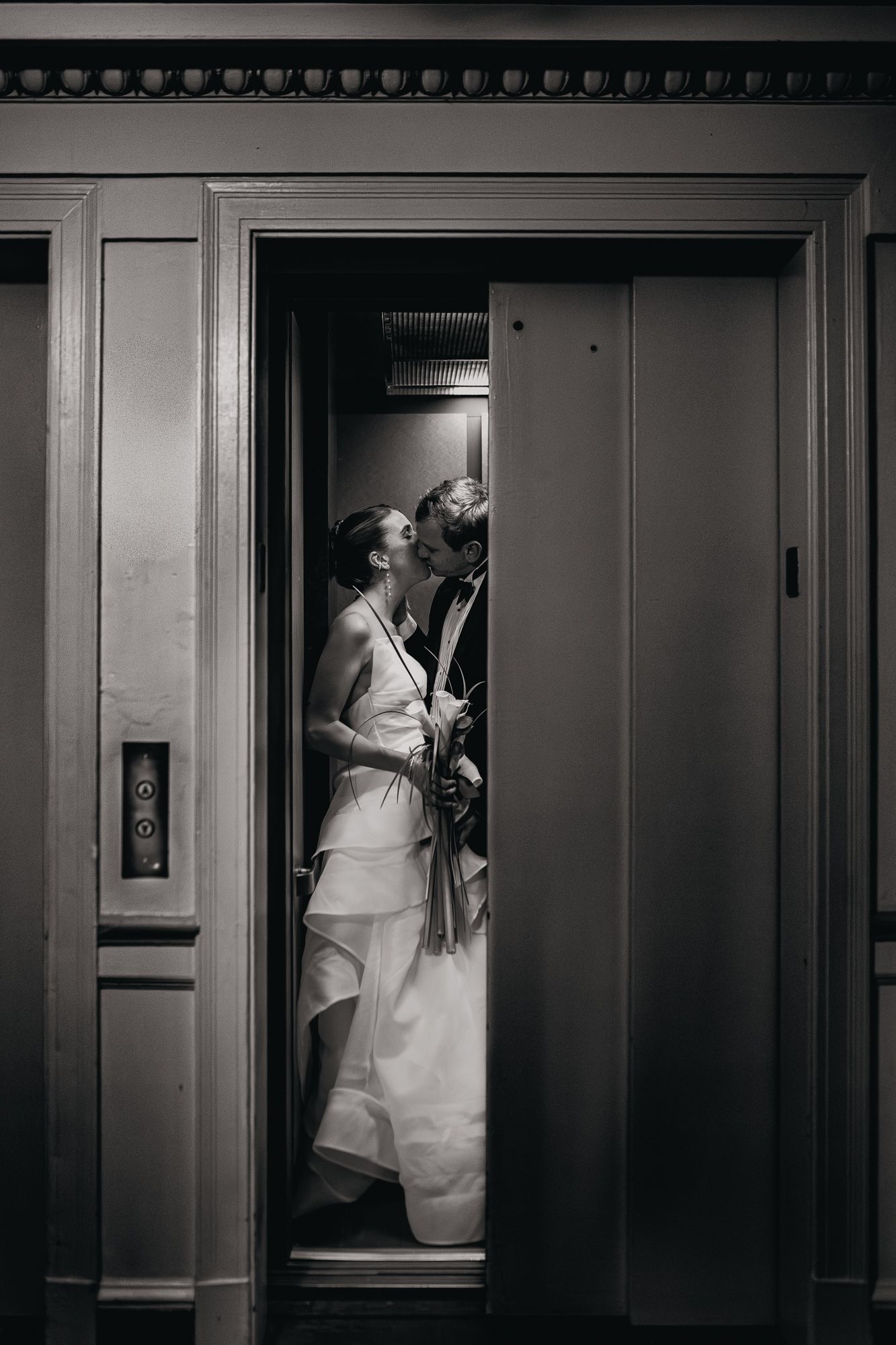 A romantic sequence of black and white wedding photos showing a couple sharing intimate moments in an elevator.