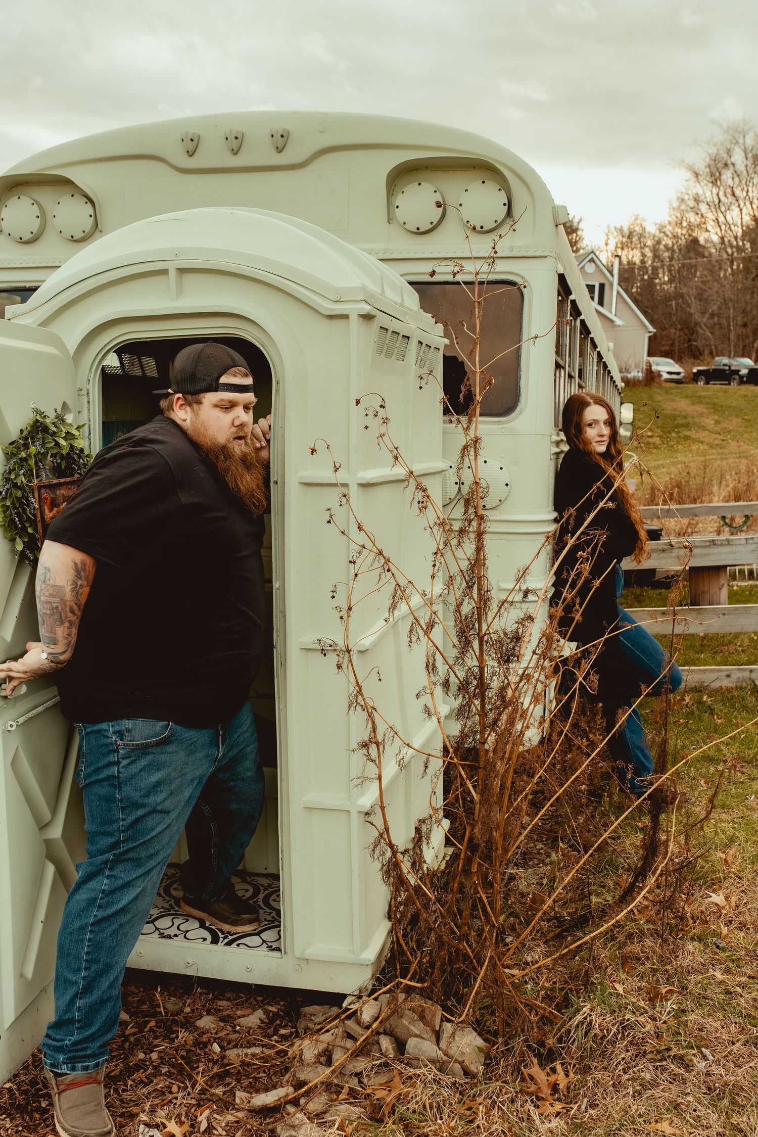 A sequence of photos showing someone inspecting and examining the interior of a vintage white camper trailer.
