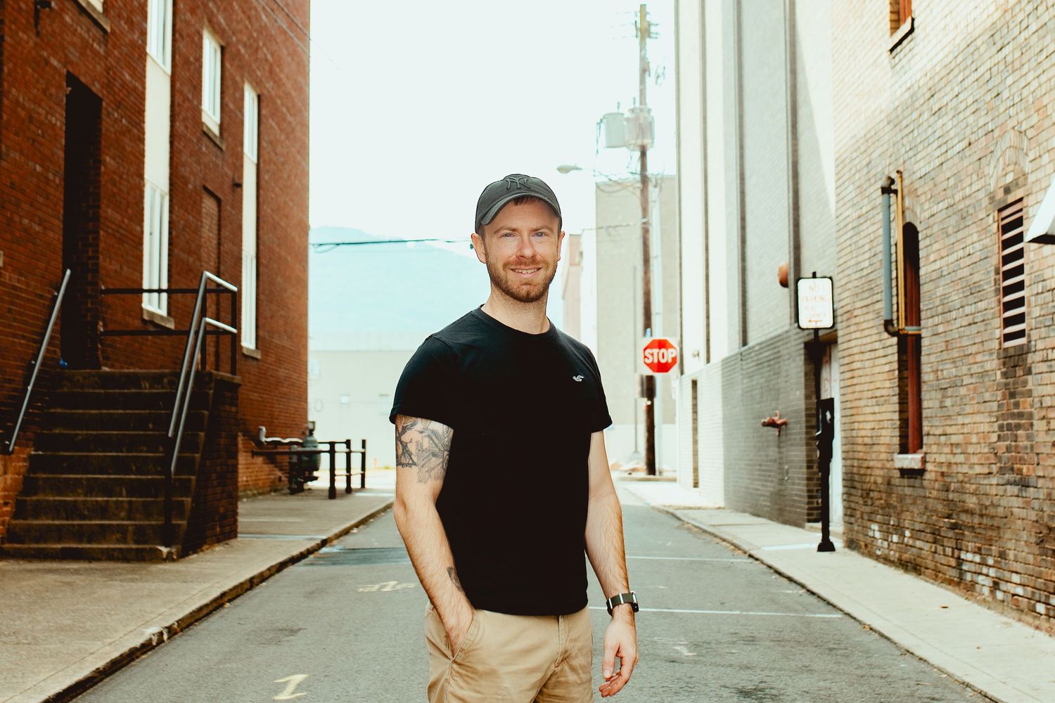 A series of connected urban alleyway photos showing brick walls and walkways in warm lighting.
