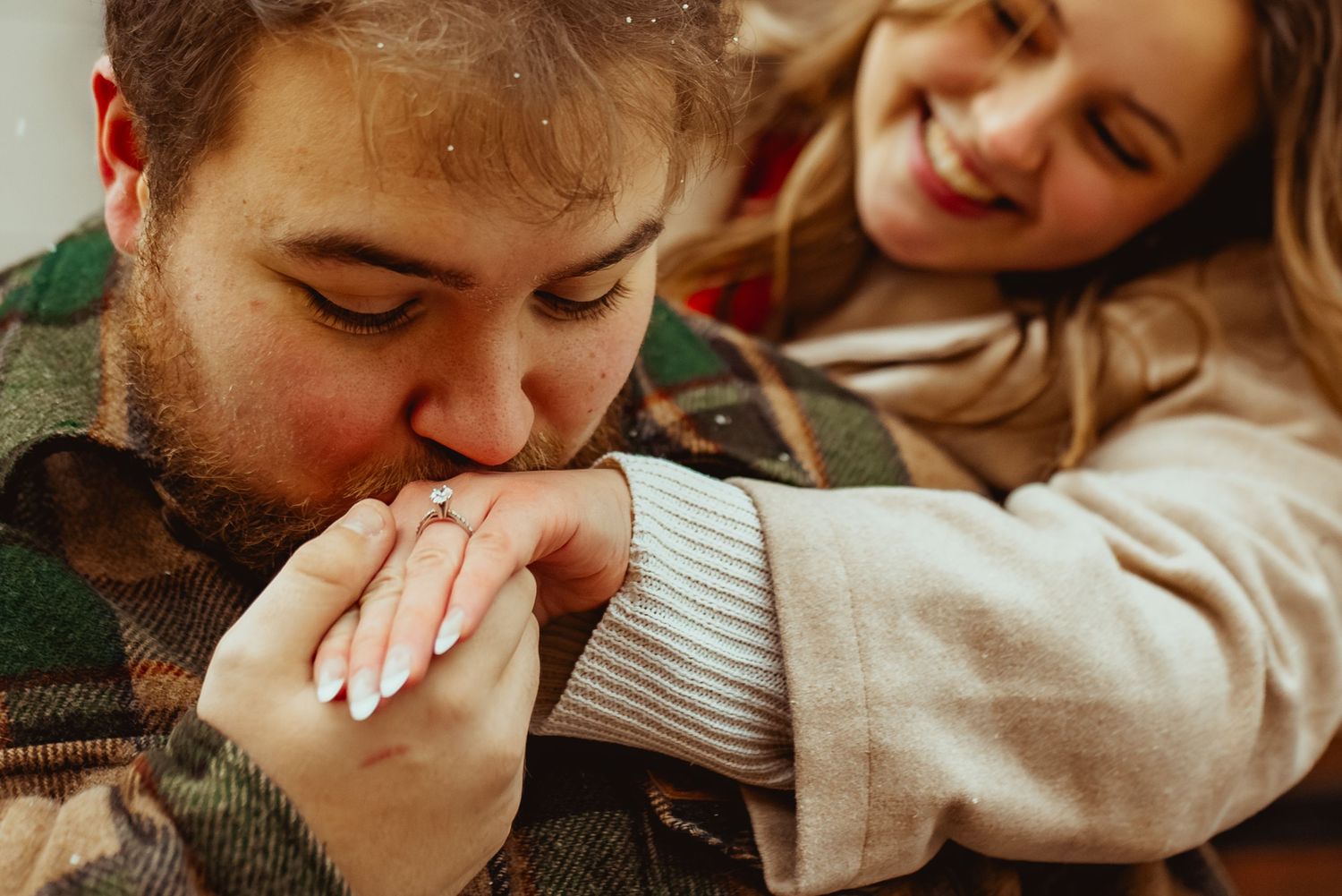 Close-up candid shots of a couple laughing and sharing intimate moments together.