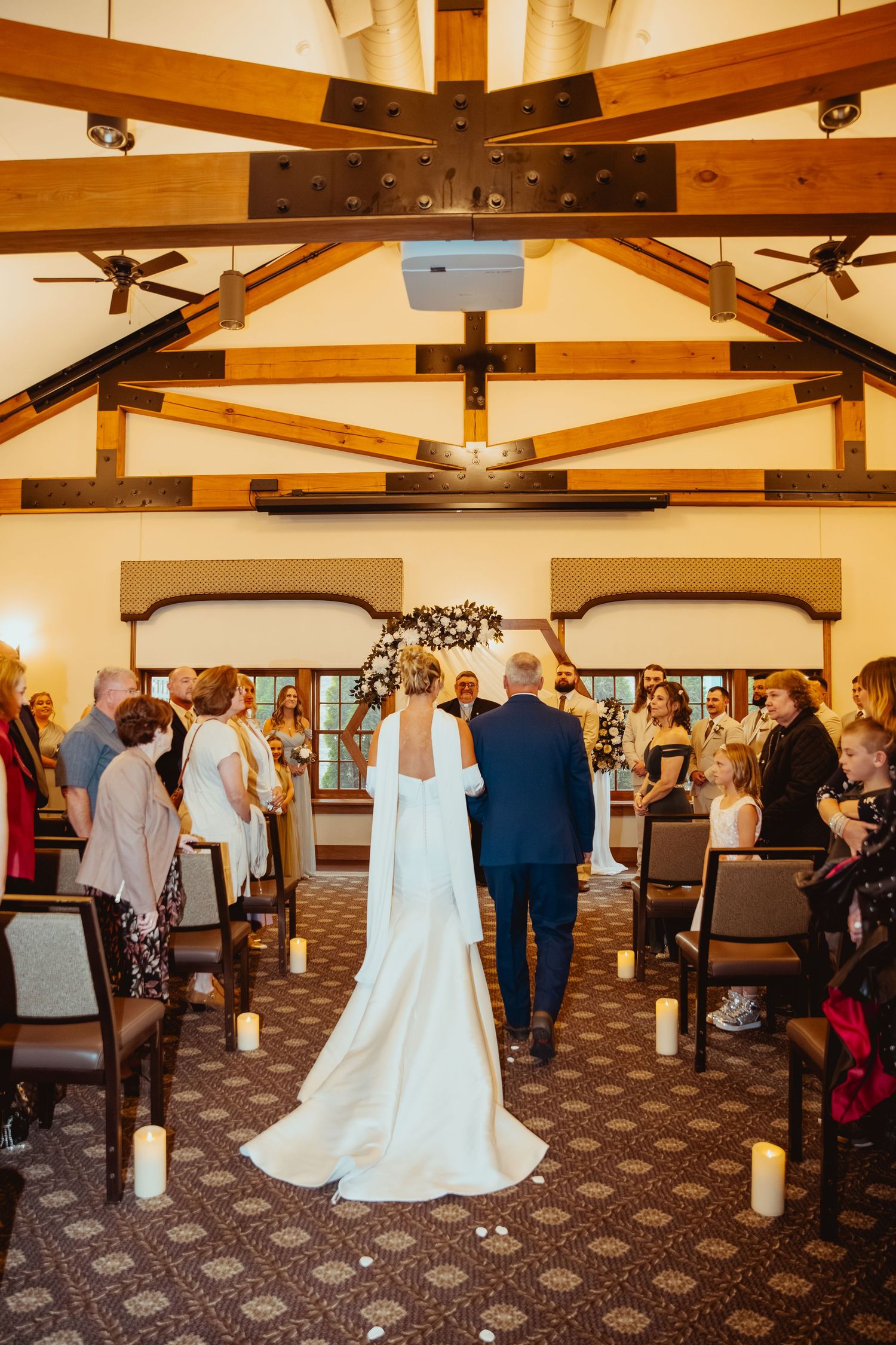 A series of interior venue shots showing wooden beams and wedding ceremony setup with guests in attendance.