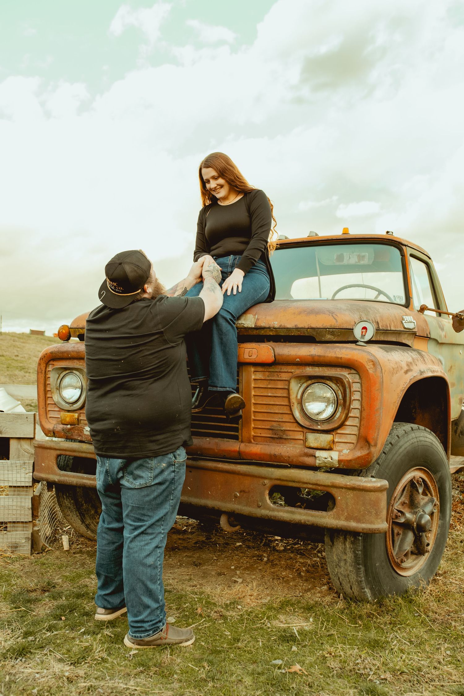 A series of photos showing people posing with an old rusty orange Ford truck in a grassy field.