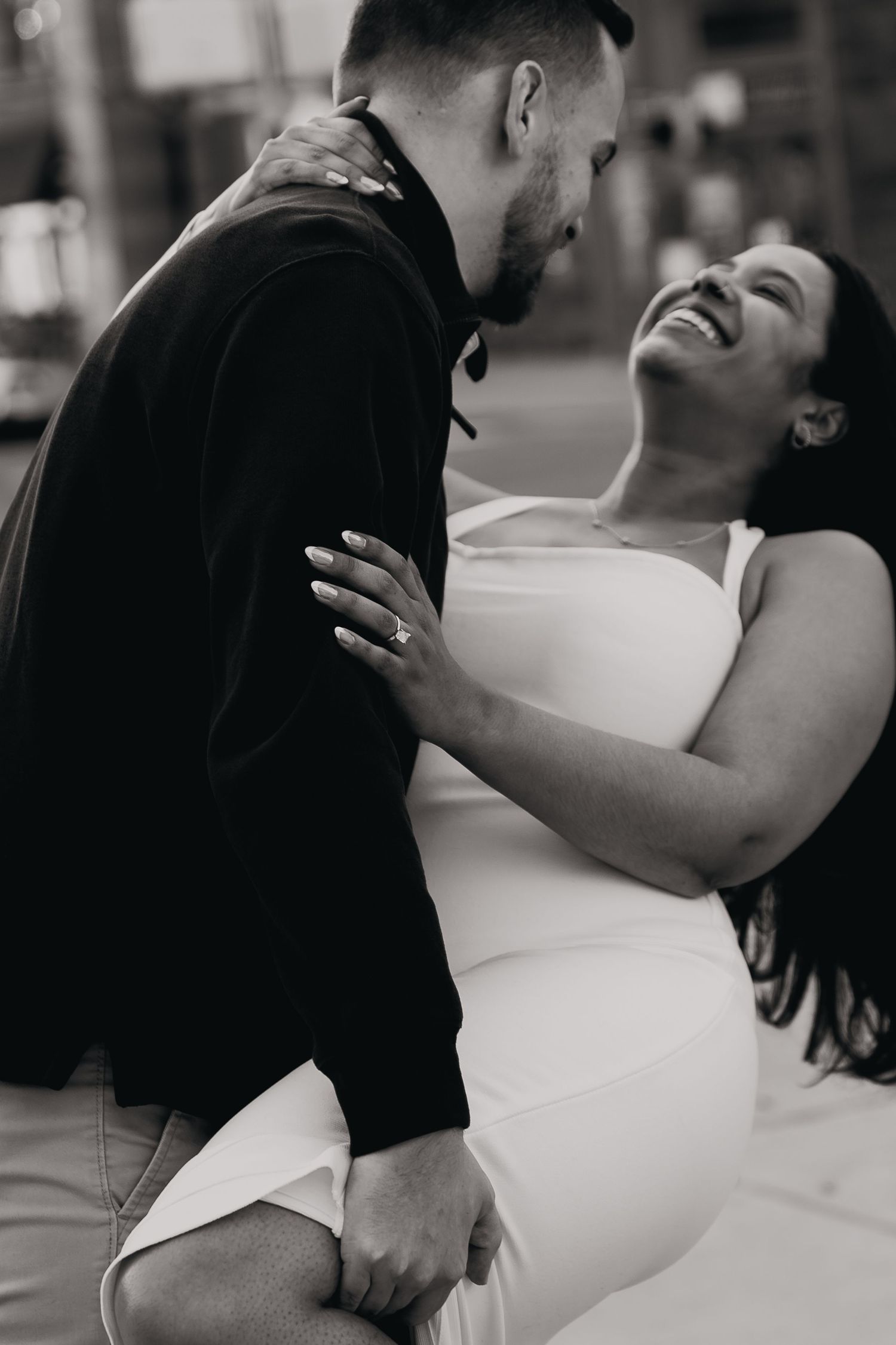 A romantic black and white photo series showing intimate moments between a couple embracing.