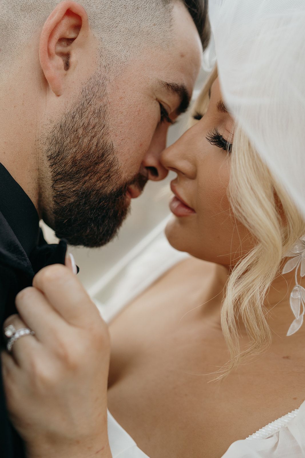 Intimate close-up wedding photos showing tender moments between newlyweds.