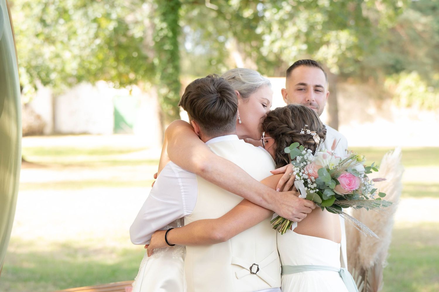 A collage of wedding photos showing couples embracing during an outdoor celebration.