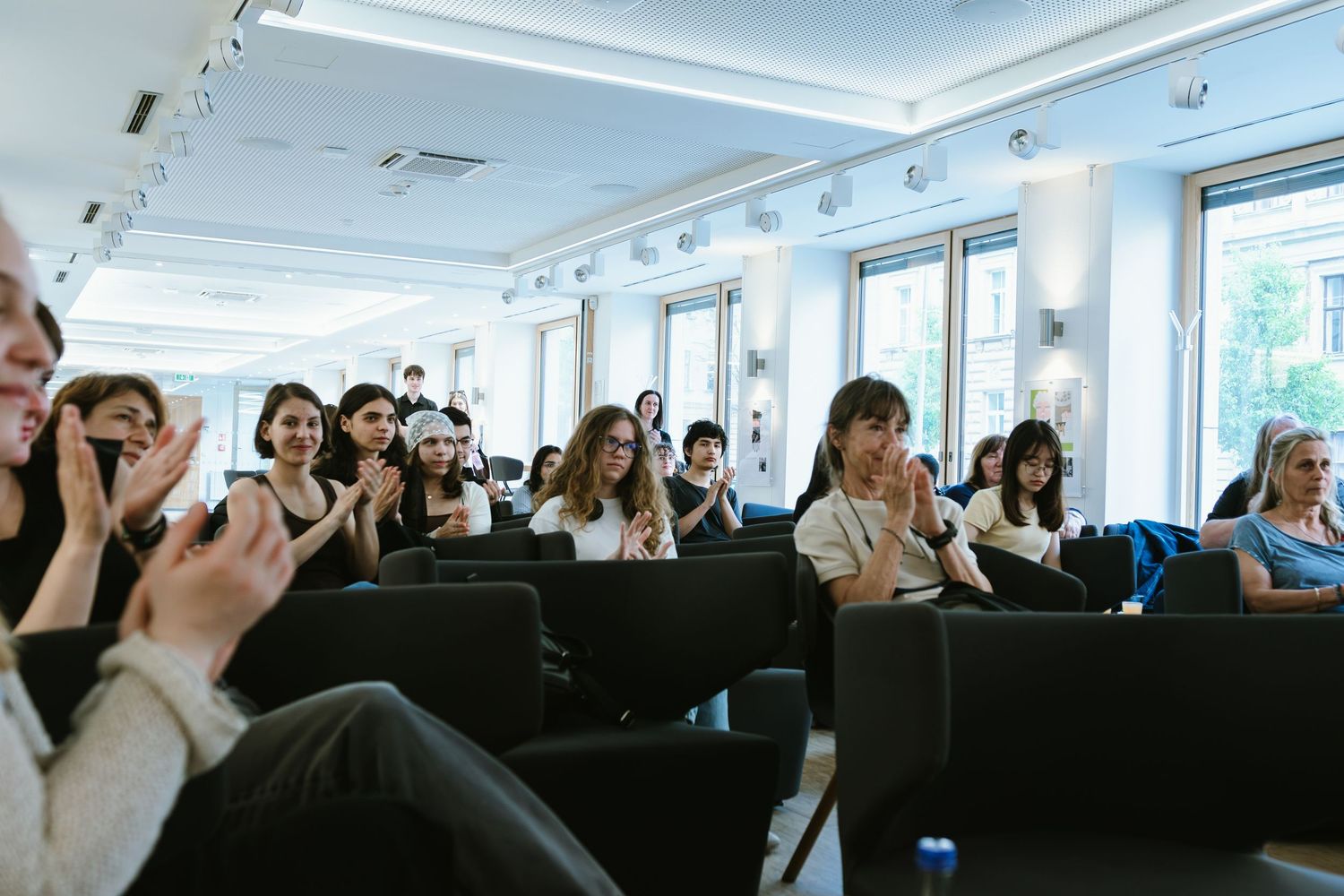 Conference room filled with attendees during a business presentation.