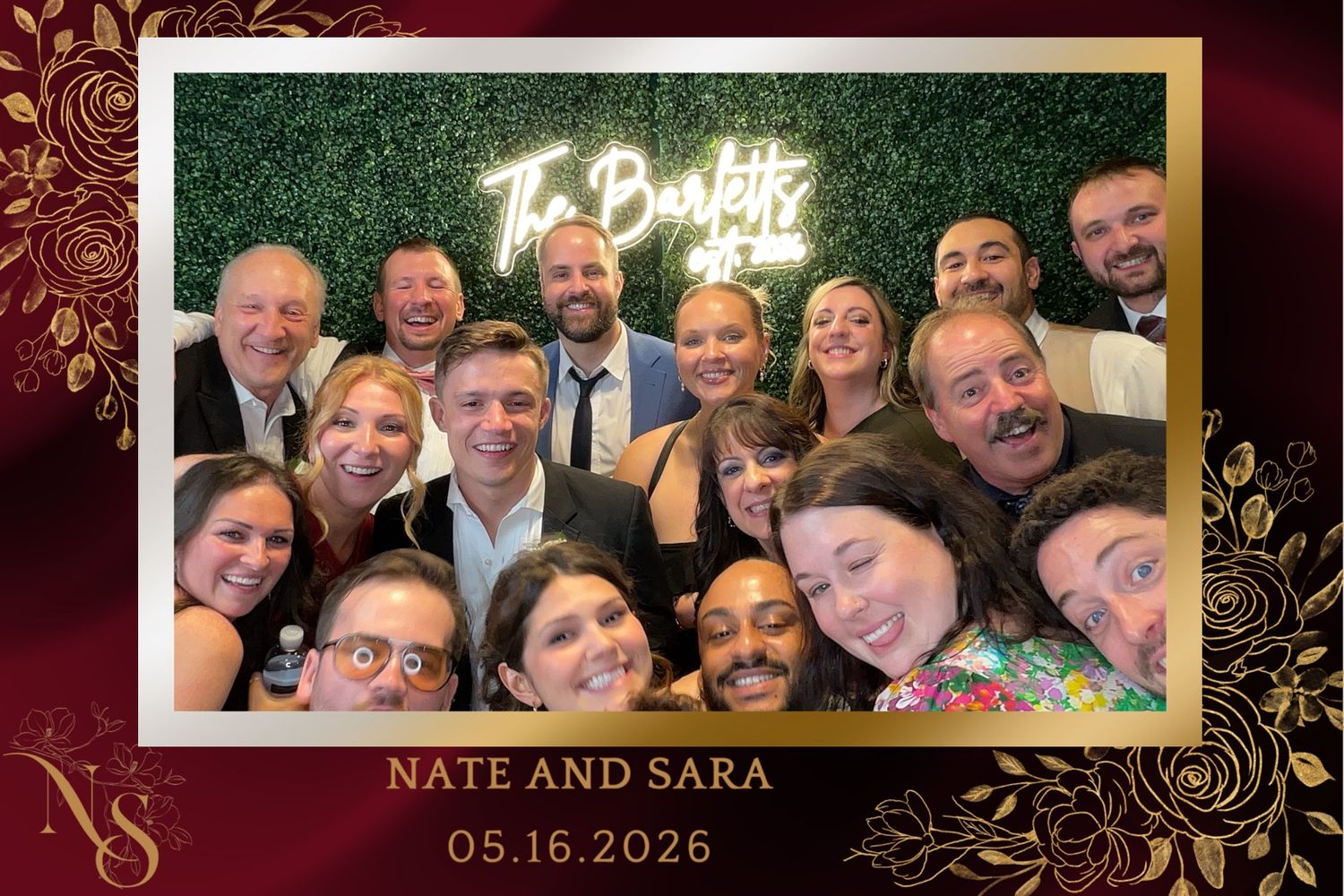 Large group of smiling guests take a fun selfie at Nate and Sara's wedding photo booth on 05.16.2026.