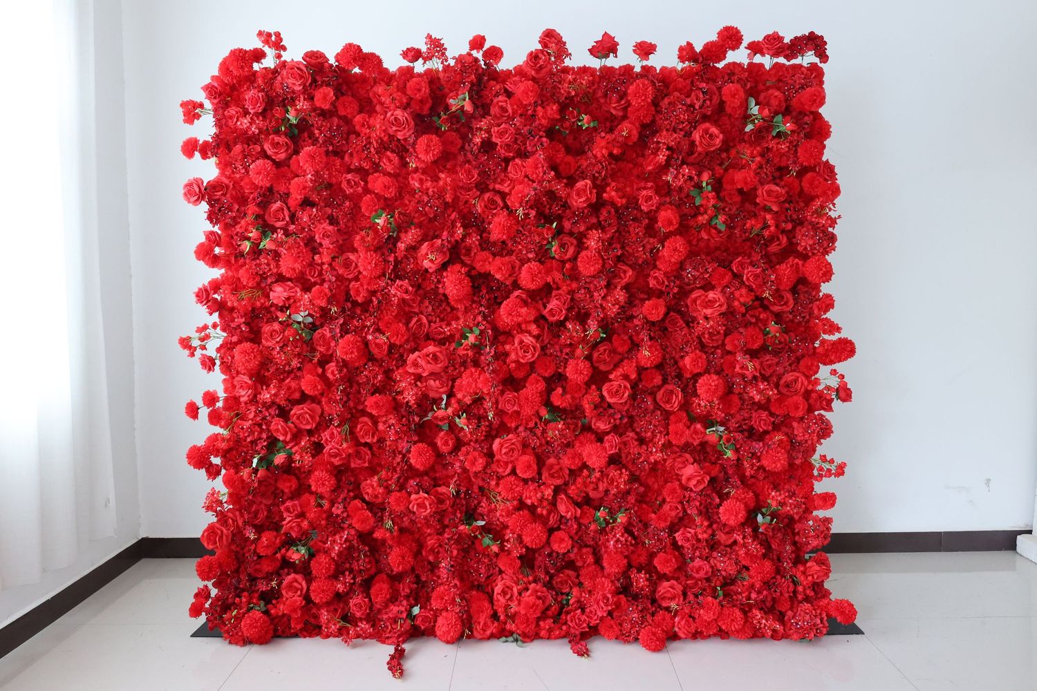 Lush red  rose flower wall backdrop for weddings and events.