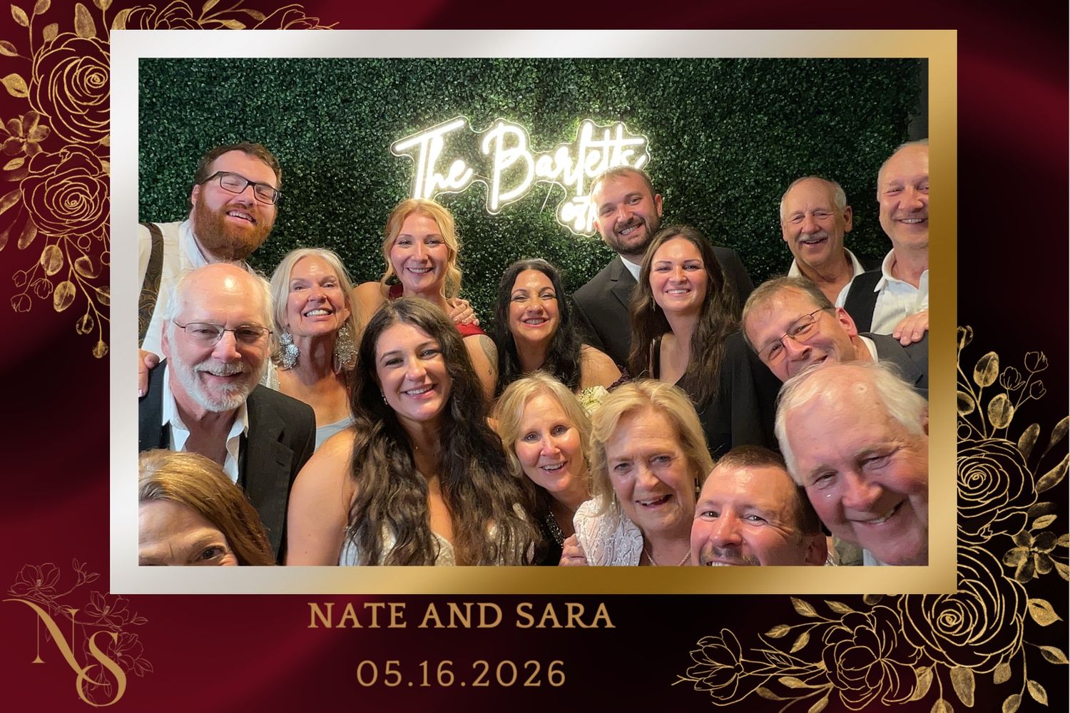 Group of cheerful wedding guests pose together at Nate and Sara's wedding photo booth on 05.16.2026.