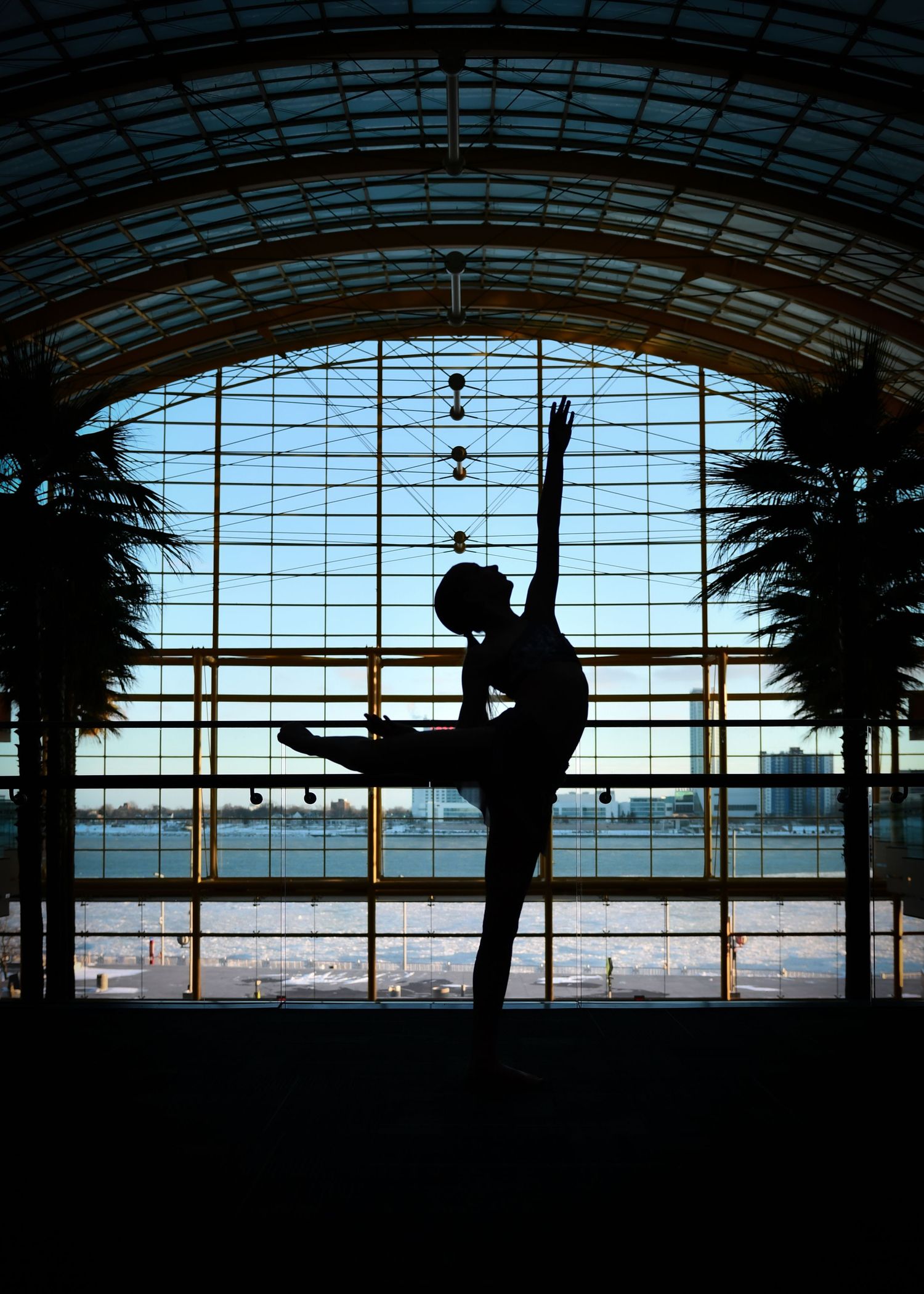 Artistic silhouette of a dancer posing in front of tall arched windows at NUVO Detroit
GM renaissance center
Detroit Northville Michigan